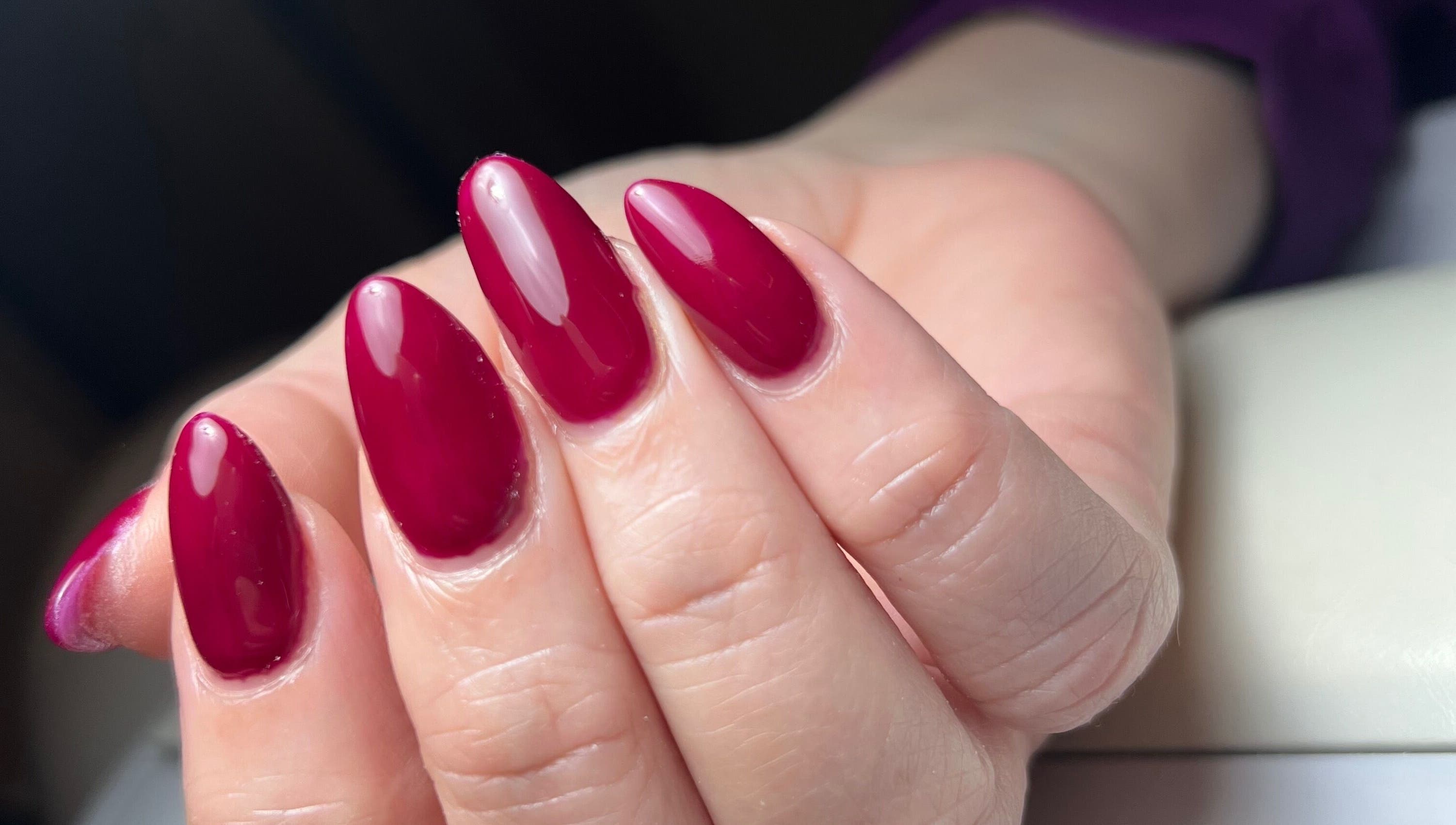 Close-up of elegant crimson nails at Cate Nails, Genève, Genève, CH, showcasing expert manicure skills.