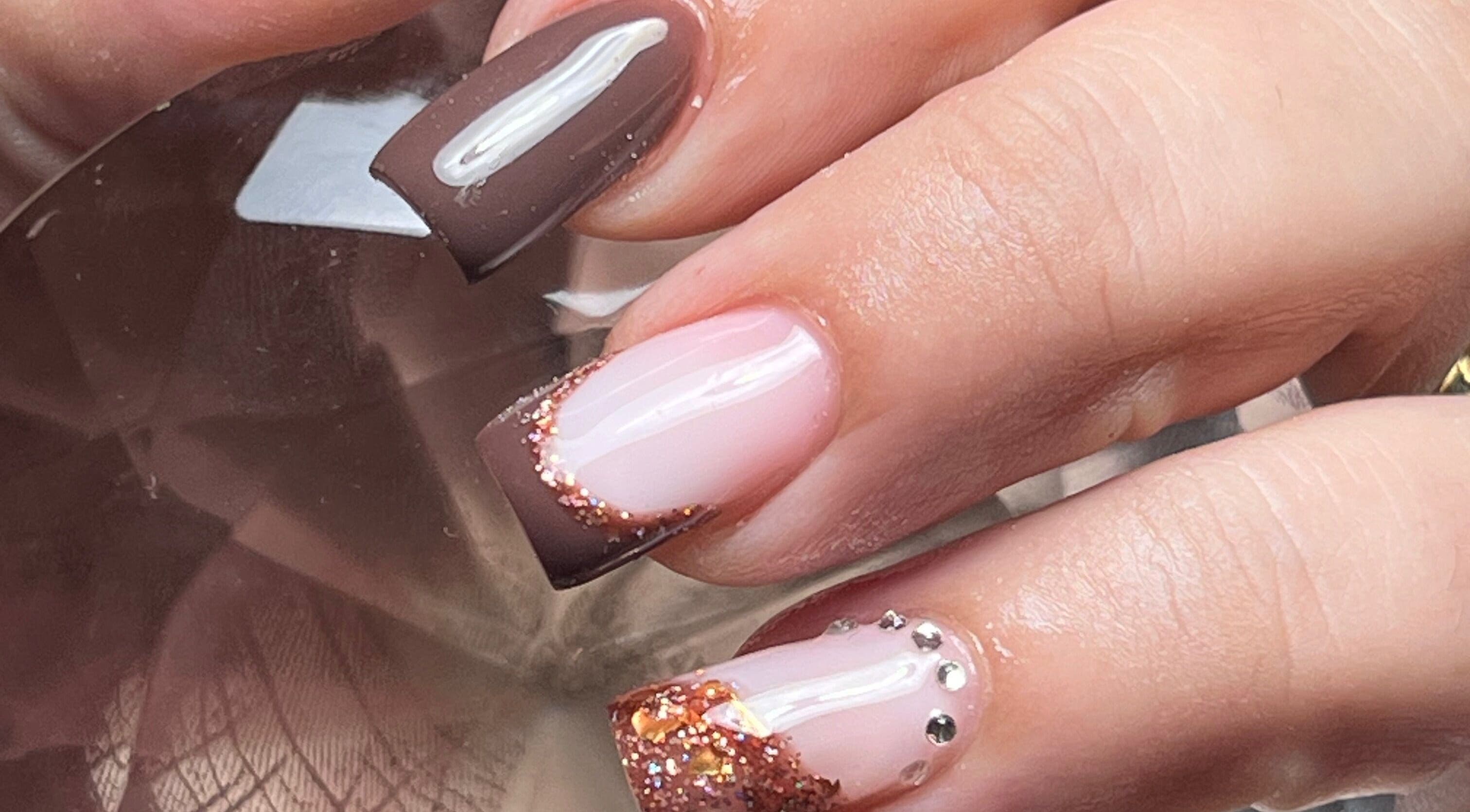 Elegant nail art with glitter and rhinestones at Cate Nails, Genève, Genève, CH.