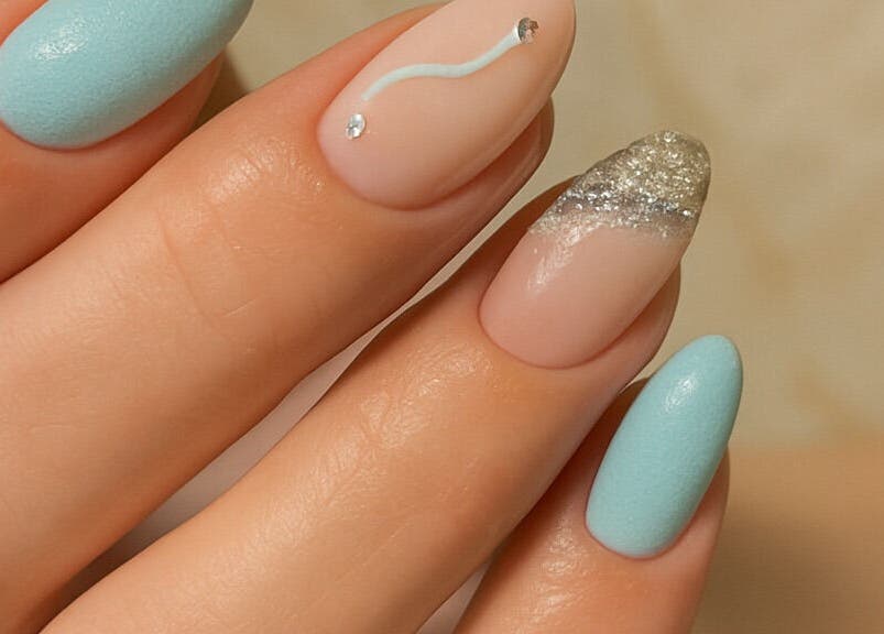 Beautiful nail art with blue and glitter accents at Cate Nails, Genève, Genève, CH.