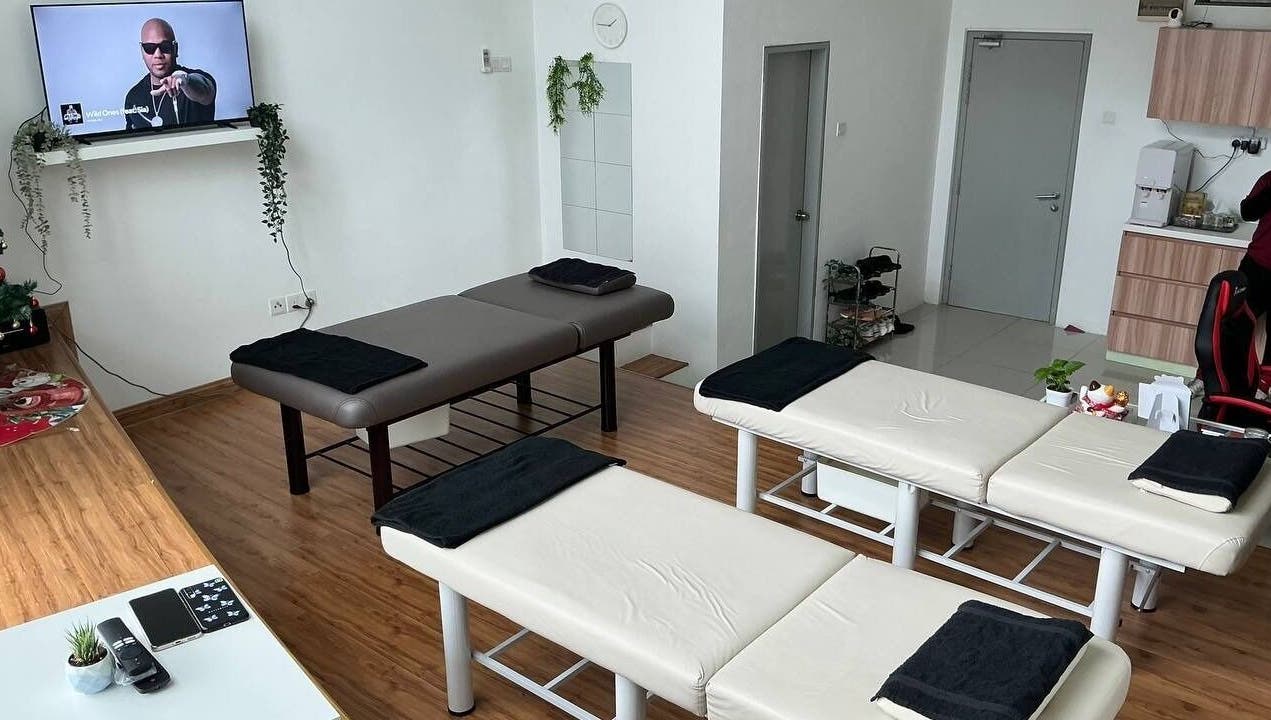 Spacious massage room at Shisei Wellness, Petaling Jaya, Selangor, MY with three massage tables and modern decor.