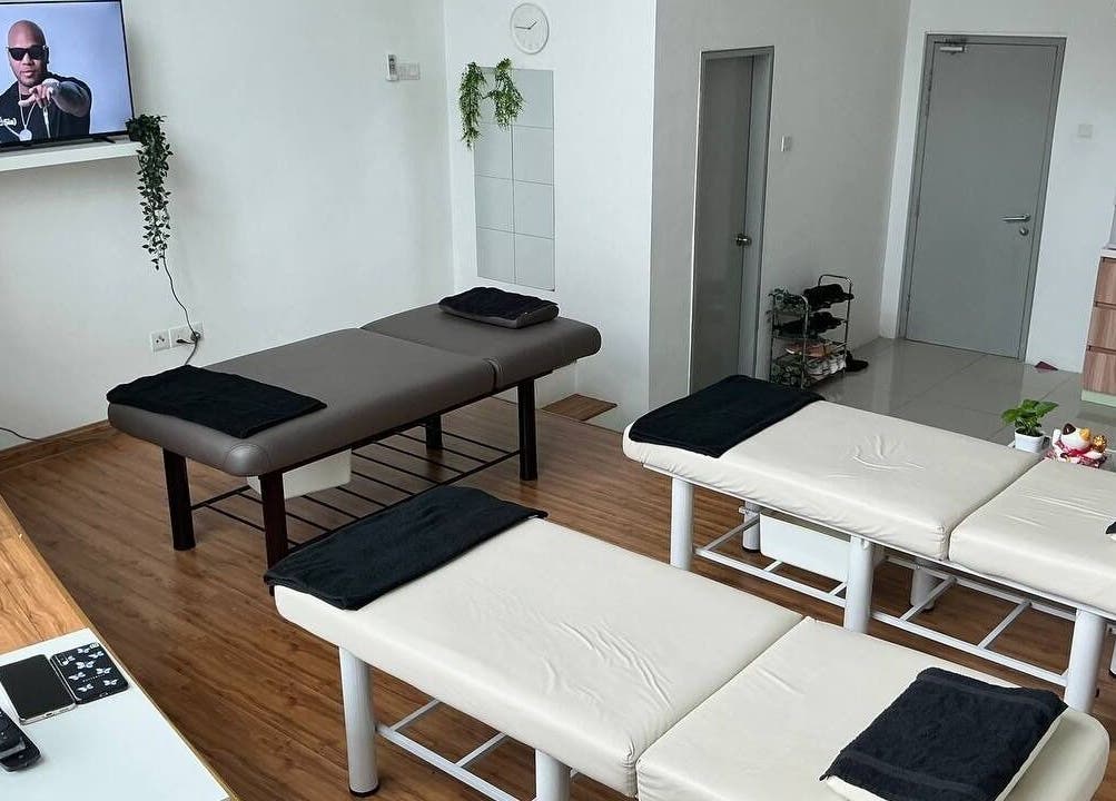 Spacious massage room at Shisei Wellness, Petaling Jaya, Selangor, MY with three massage tables and modern decor.