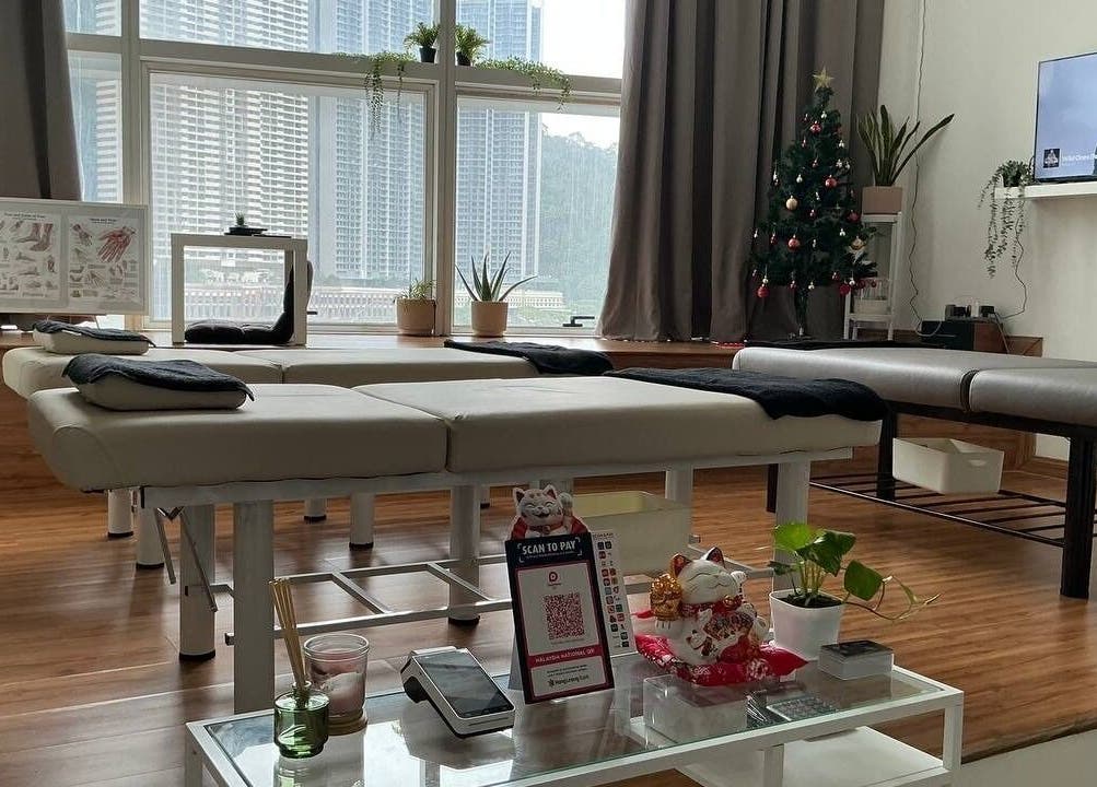 Sleek massage room at Shisei Wellness, Petaling Jaya, Selangor, MY, featuring modern decor and city views.