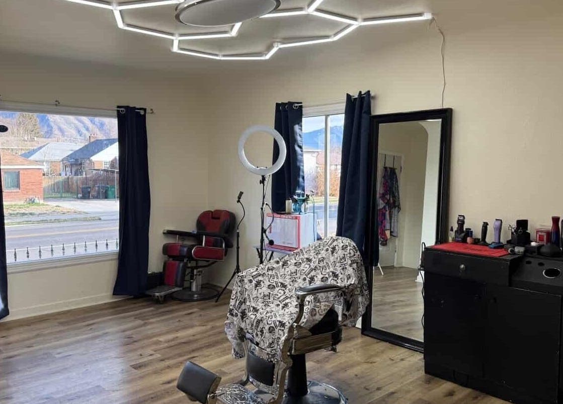 Elegant salon interior at Notorius Blends, Provo, Utah, US featuring a stylish chair and modern lighting.