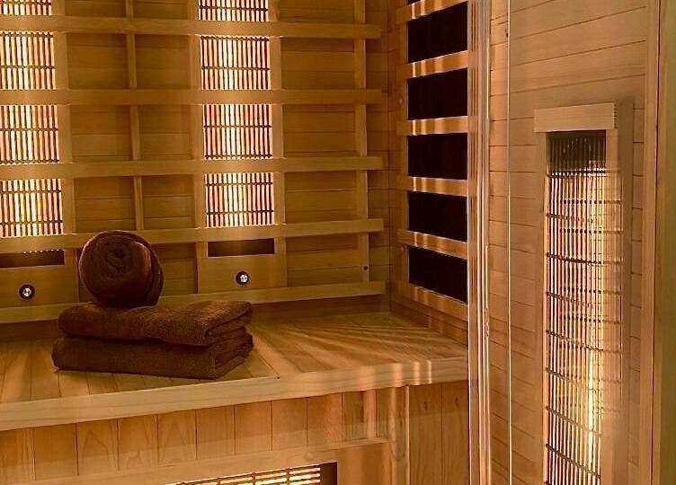 Cozy sauna ambiance at Roll Studio in Boksburg, Gauteng, ZA, featuring wooden interiors and plush towels.