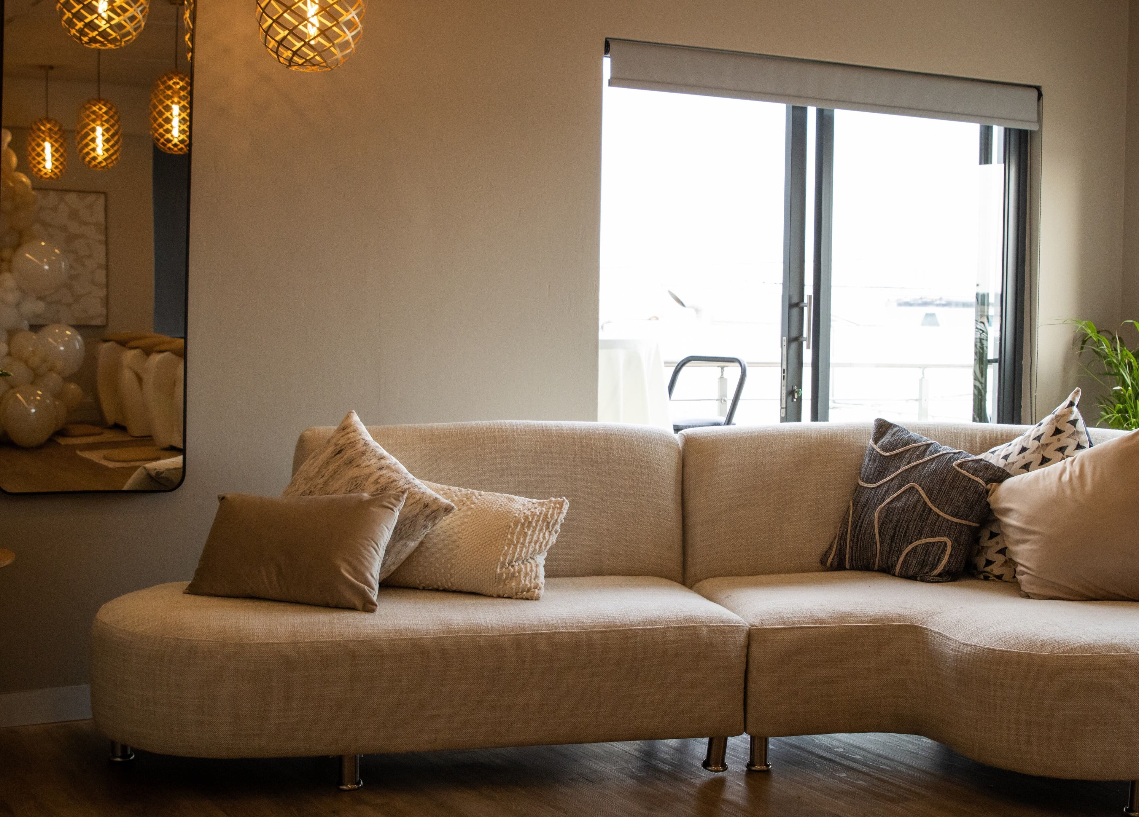 Cozy lounge area at Roll Studio, Boksburg, Gauteng, ZA with plush pillows and warm lighting.