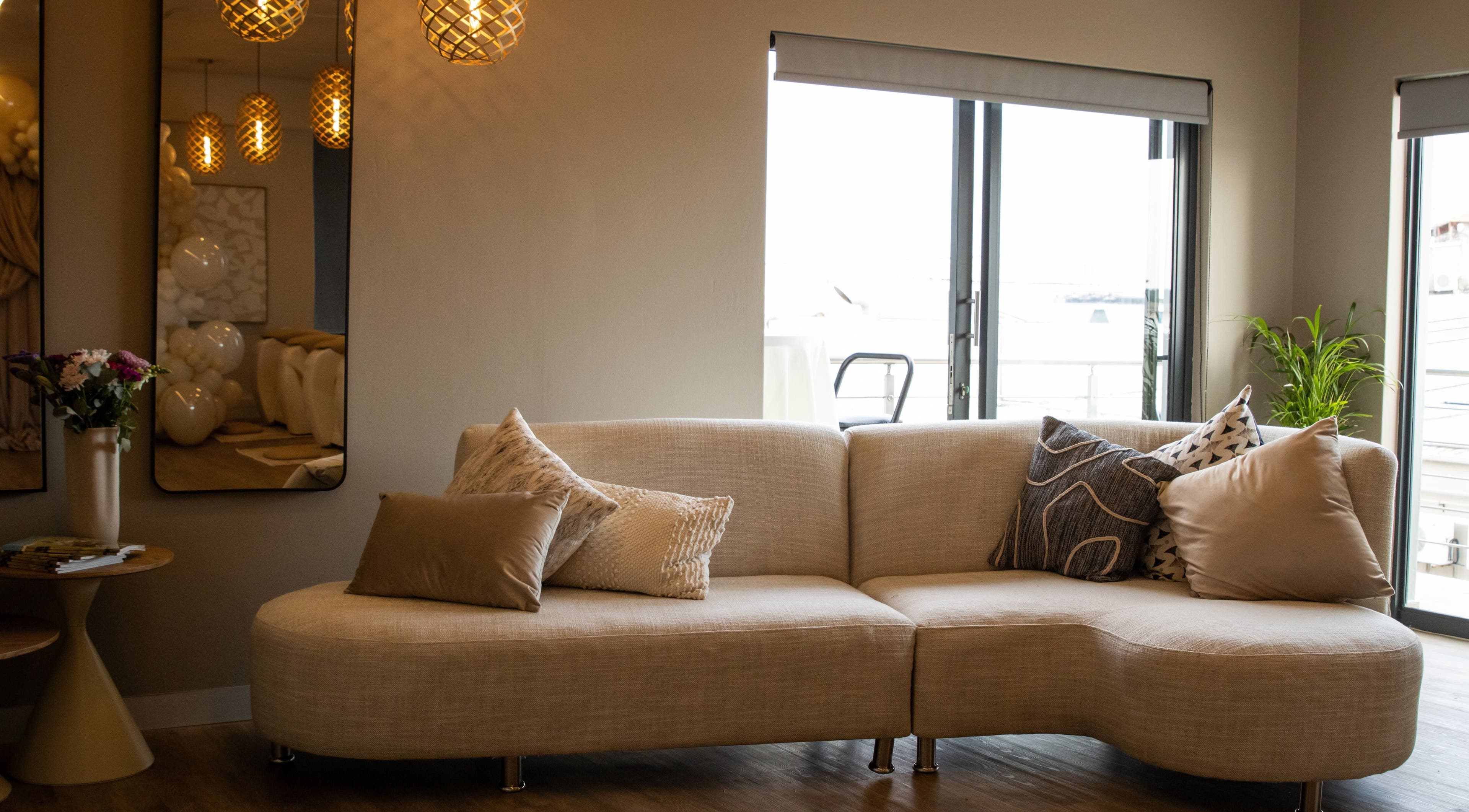 Cozy lounge area at Roll Studio, Boksburg, Gauteng, ZA with plush pillows and warm lighting.