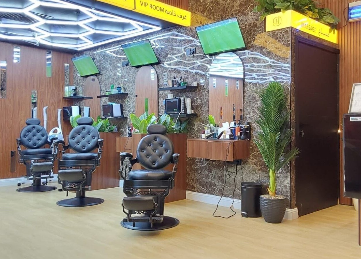 Chic barber chairs at Billionaire Salon – Al Hamra in Jeddah, Makkah Province, SA, offering luxury grooming.