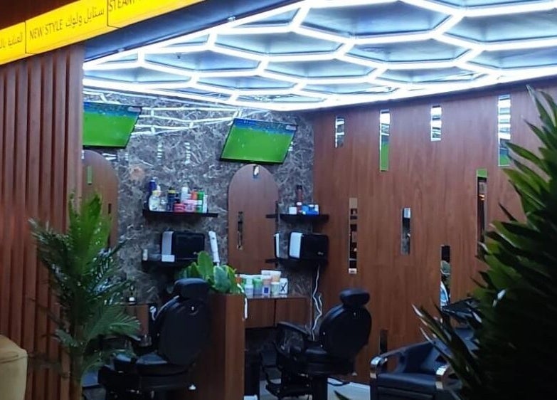 Chic interior of Billionaire Salon – Al Hamra in Jeddah, Makkah Province, SA with modern lighting and decor.