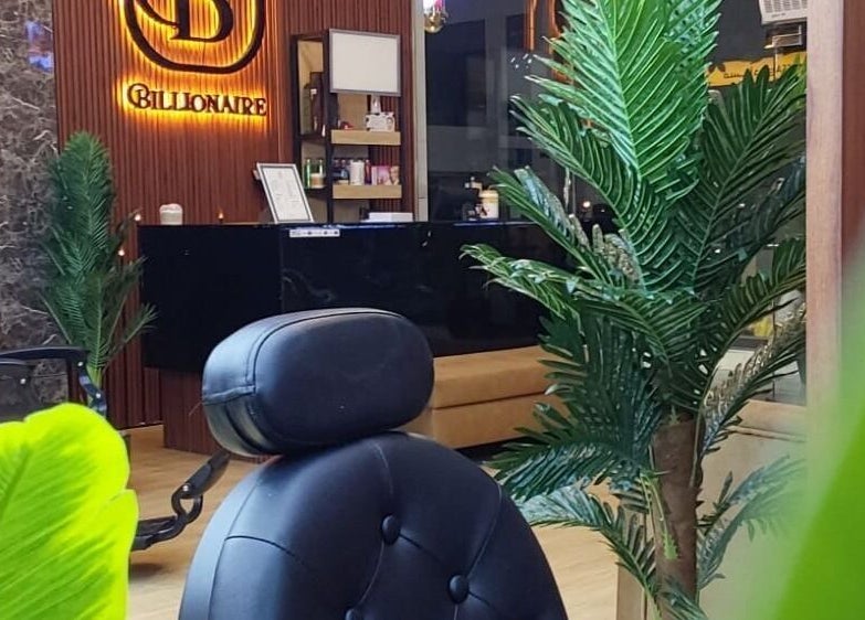 Chic interior of Billionaire Salon – Al Hamra, Jeddah, showcasing elegant decor and plush seating.