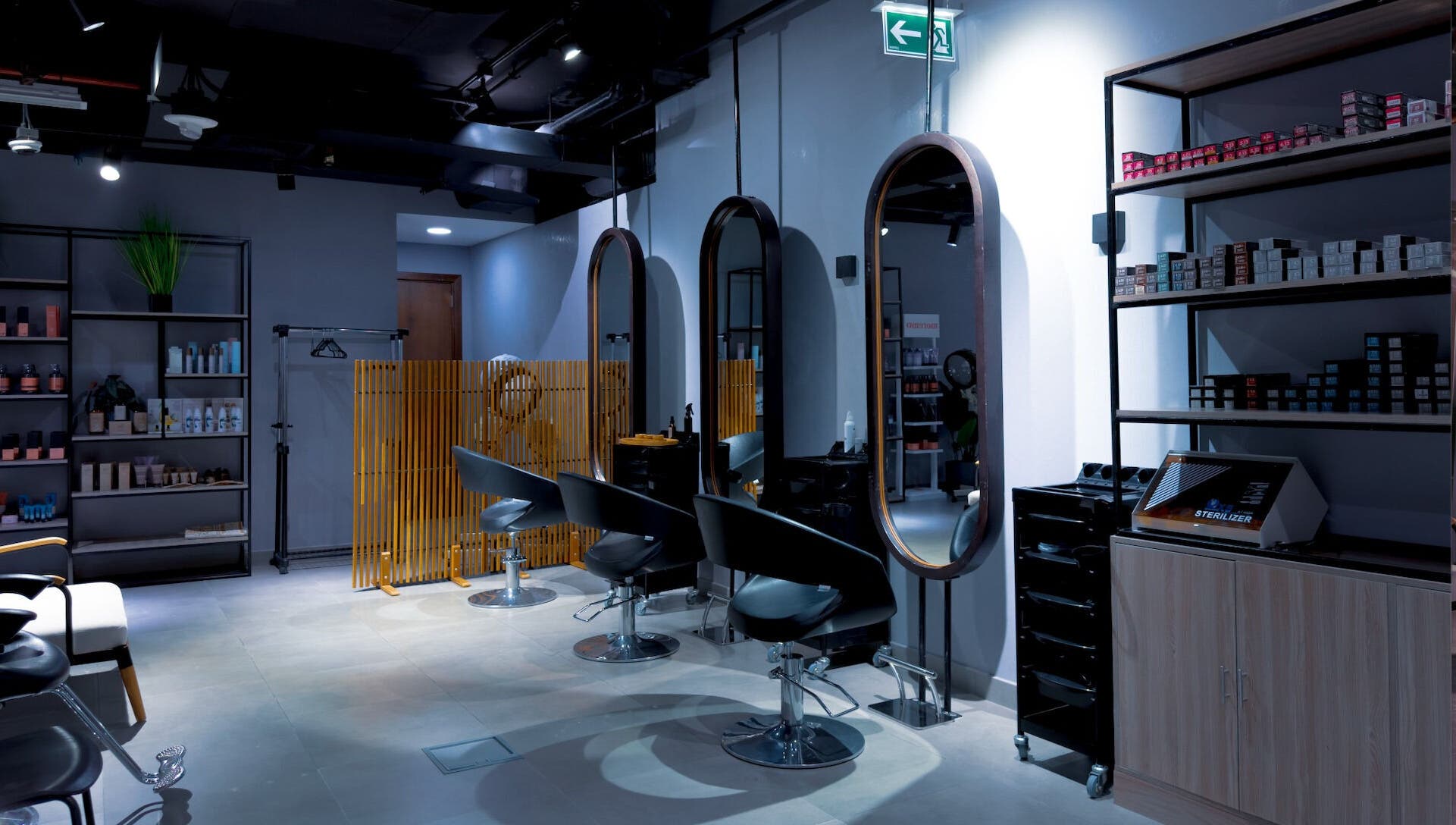 Modern interior of Painted Nails Beauty Salon in Abu Dhabi, AE featuring stylish chairs and products.
