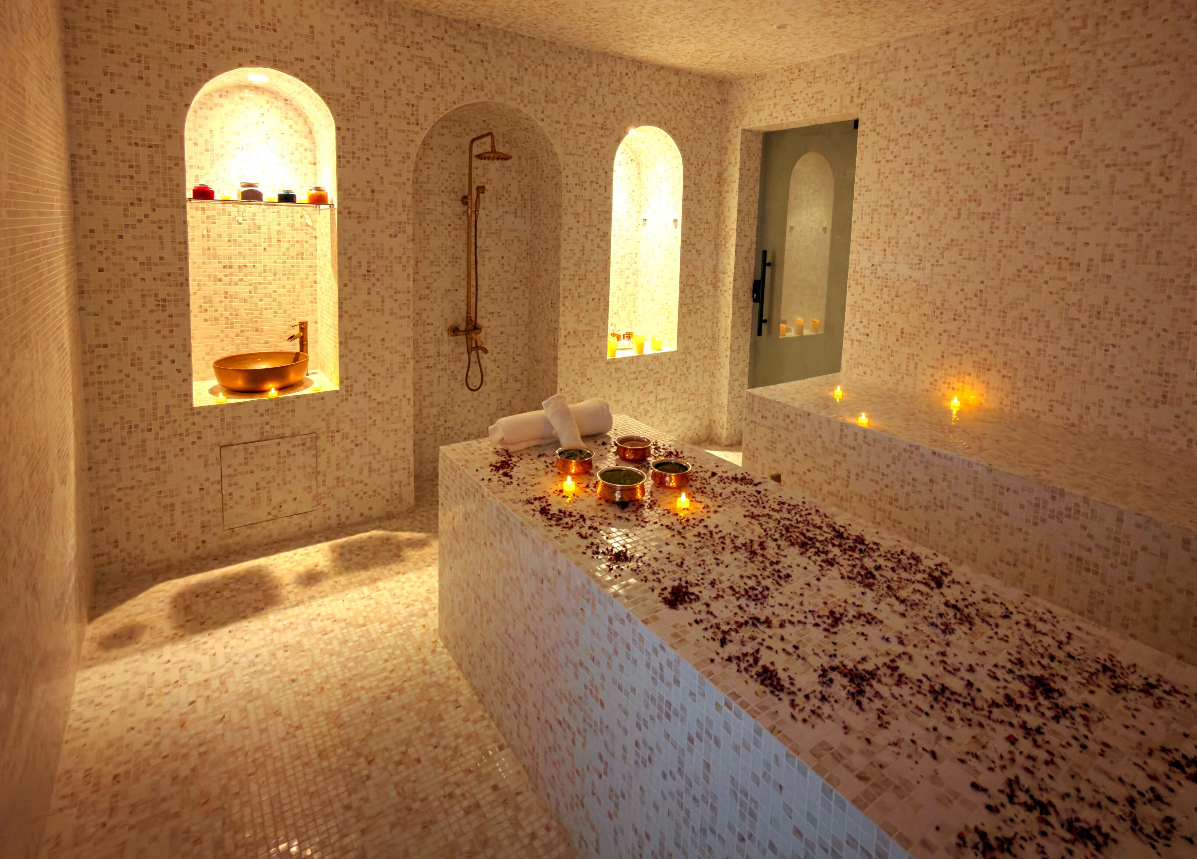 Luxury spa room at Painted Nails Beauty Salon in Abu Dhabi, AE, with candles and mosaic decor.