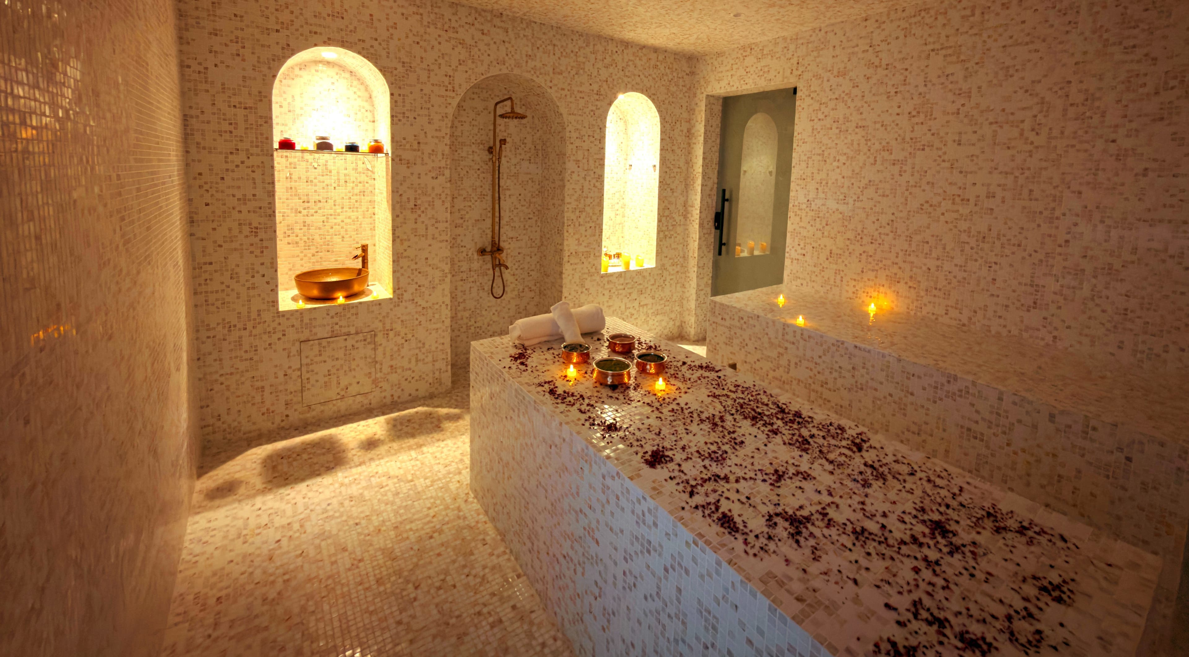 Luxury spa room at Painted Nails Beauty Salon in Abu Dhabi, AE, with candles and mosaic decor.
