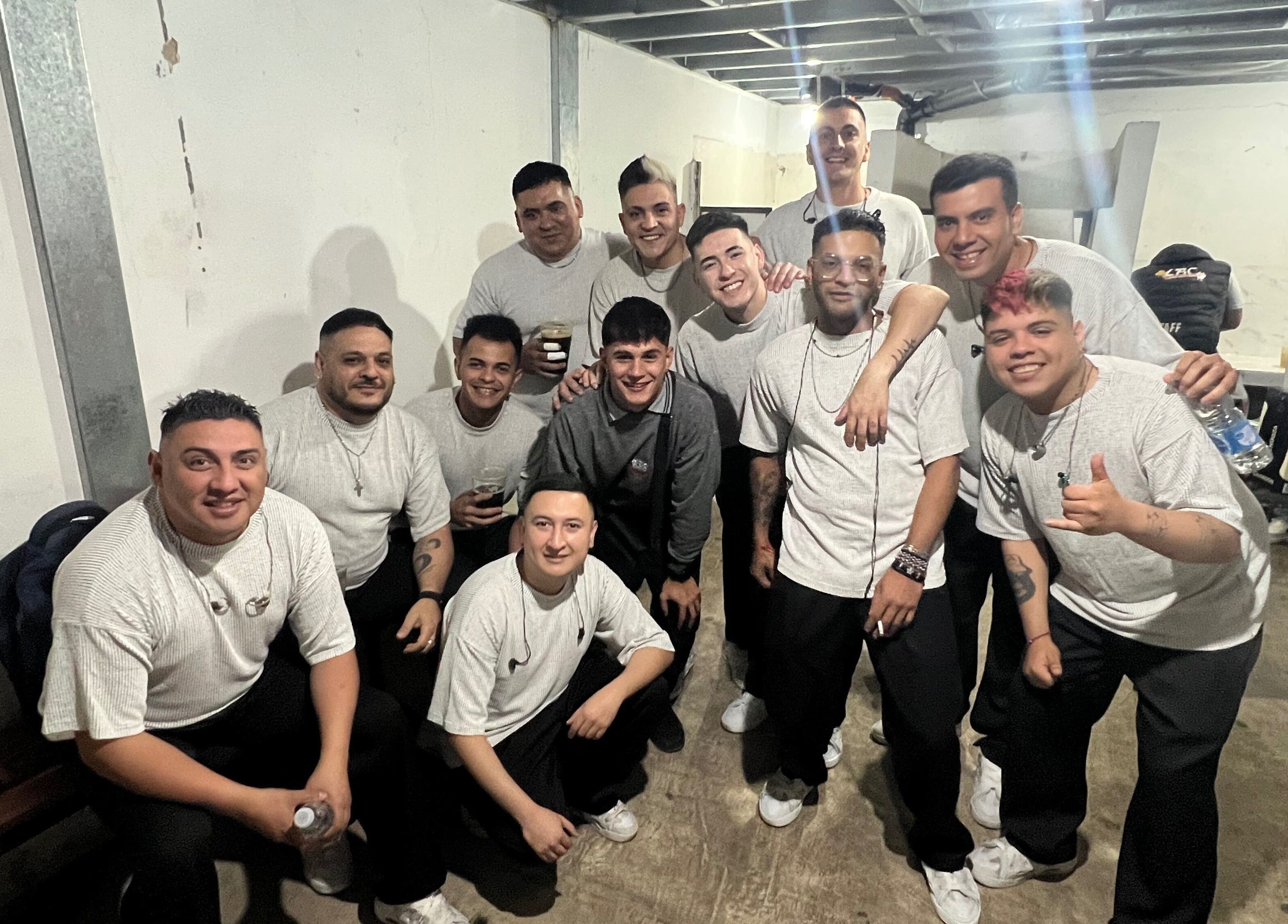 Energetic team gathering at Chispa Barberia, Córdoba, AR, showcasing unity and style.