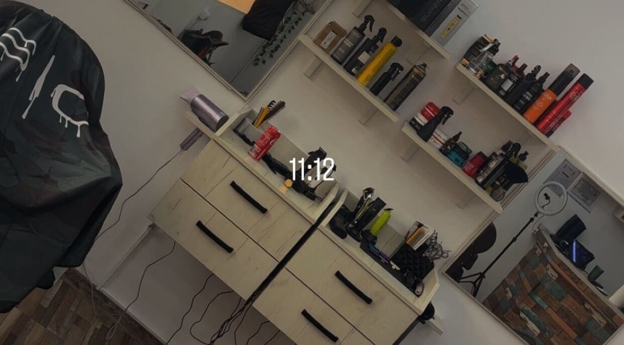 Chic barber workstation at Cristea the Barber, Râmnicu Sărat, Județul Buzău, RO, showcasing grooming products.