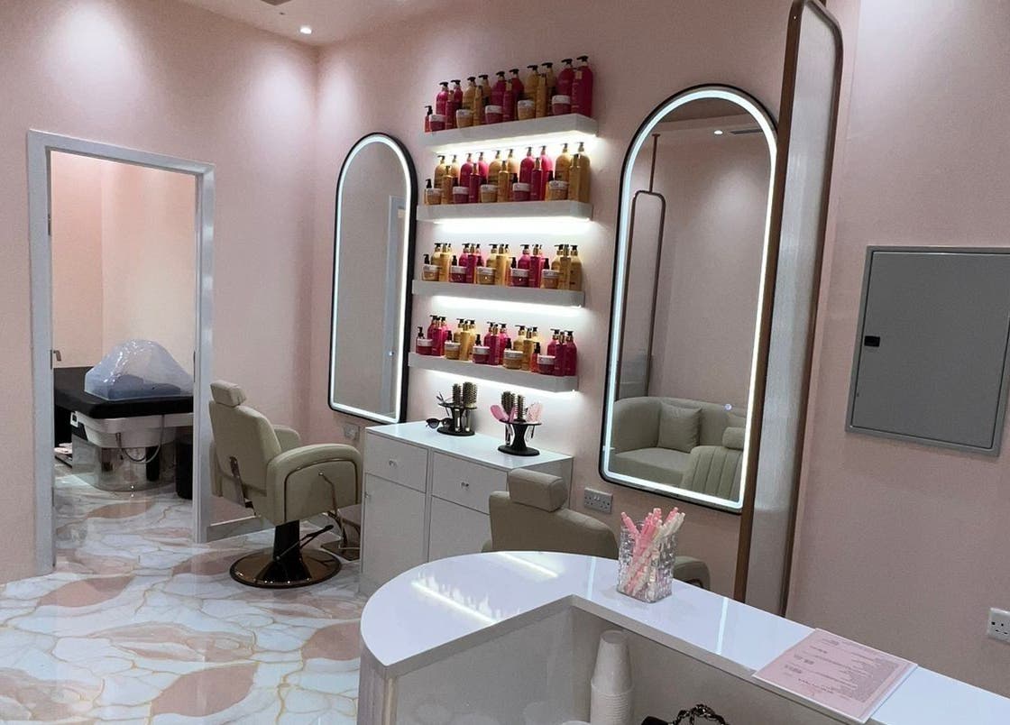 Luxurious salon interior at Crown of Serenity, featuring elegant styling chairs and mirrors in Dubai, Dubai, AE.
