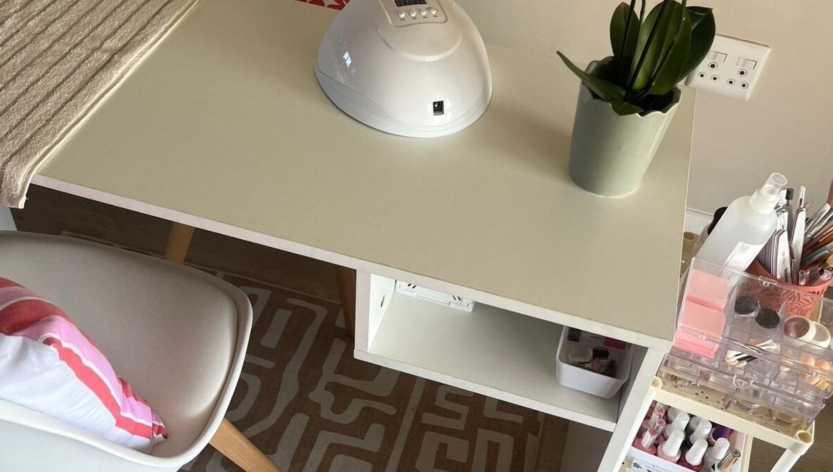 Nail station at Coastal Pearl in Gqeberha, Eastern Cape, ZA featuring manicure tools and greenery.