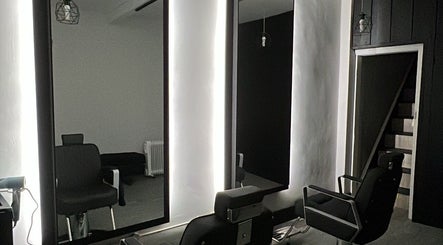 Modern salon chairs and mirrors at The Stockroom in Henlow, England, GB.
