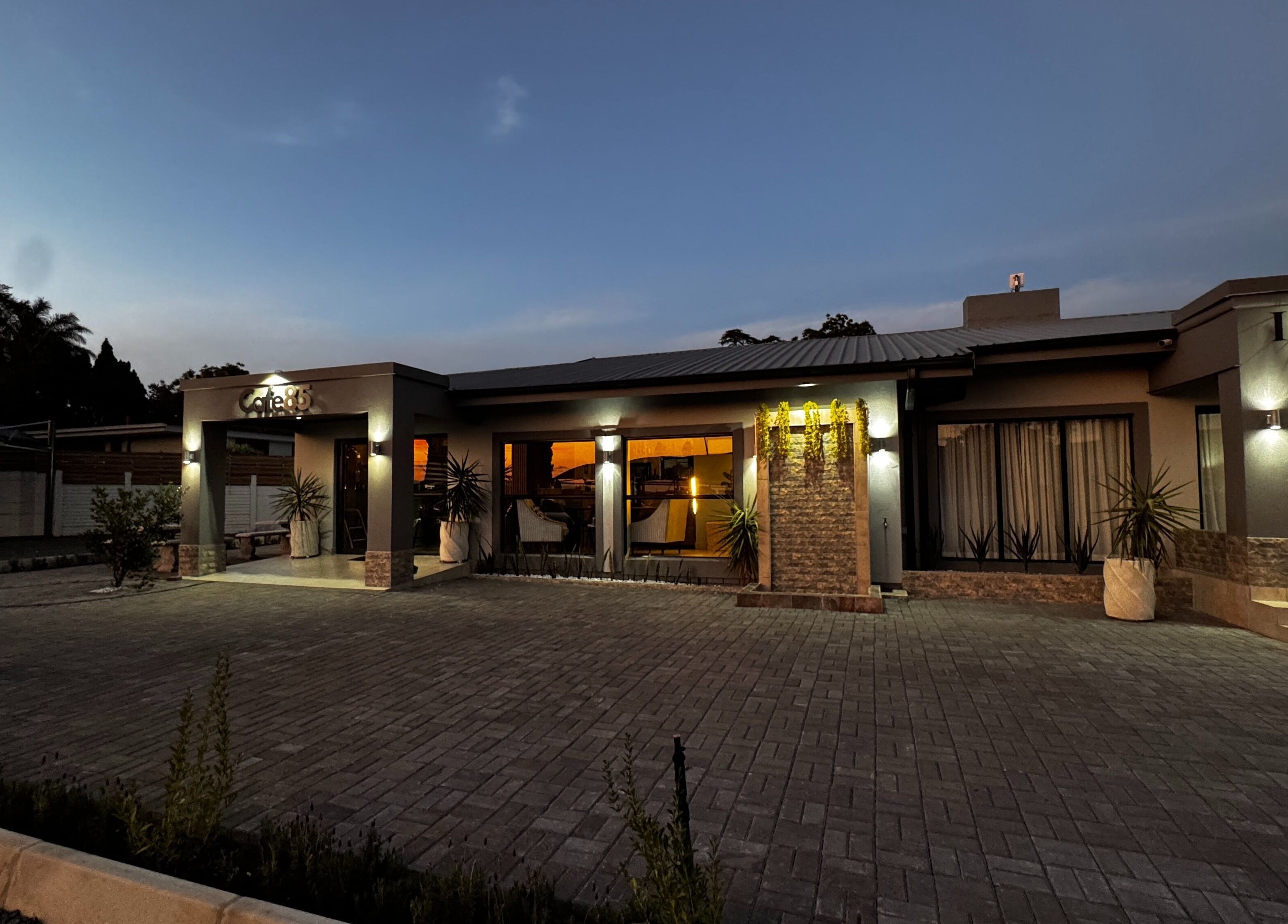 Immortal Rejuvenation Clinic at dusk in Newcastle, Kwazulu-natal, ZA, beautifully illuminated exterior.