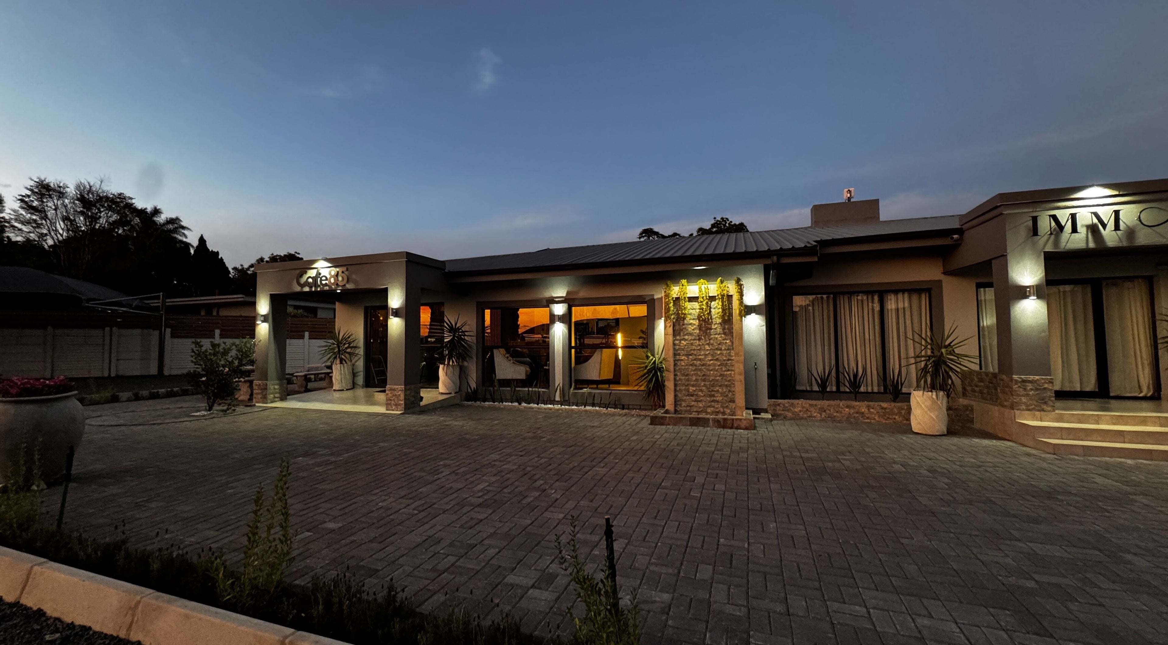 Immortal Rejuvenation Clinic at dusk in Newcastle, Kwazulu-natal, ZA, beautifully illuminated exterior.