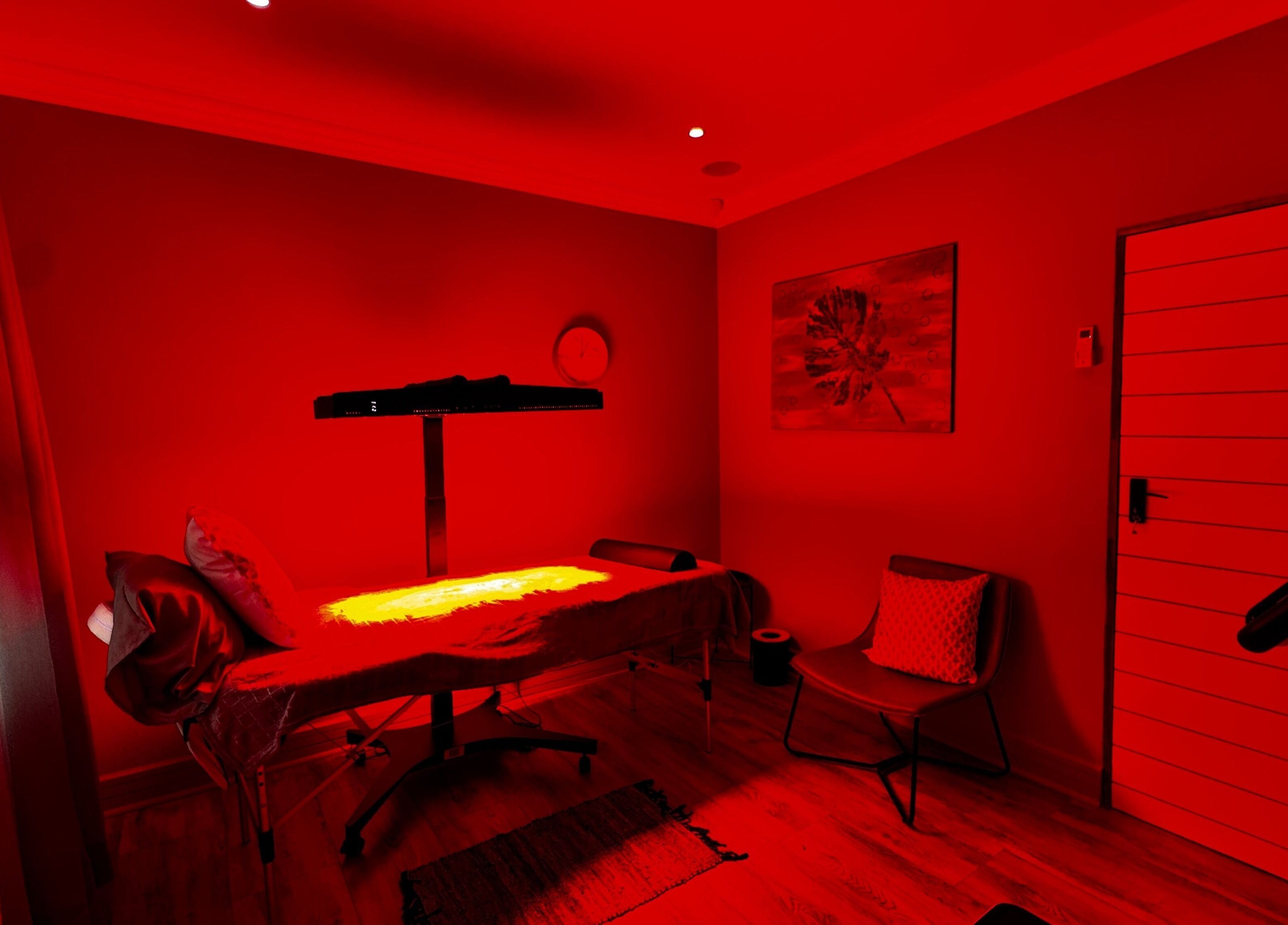 Therapy room with warm red lighting at Immortal Rejuvenation Clinic, Newcastle, Kwazulu-natal, ZA.