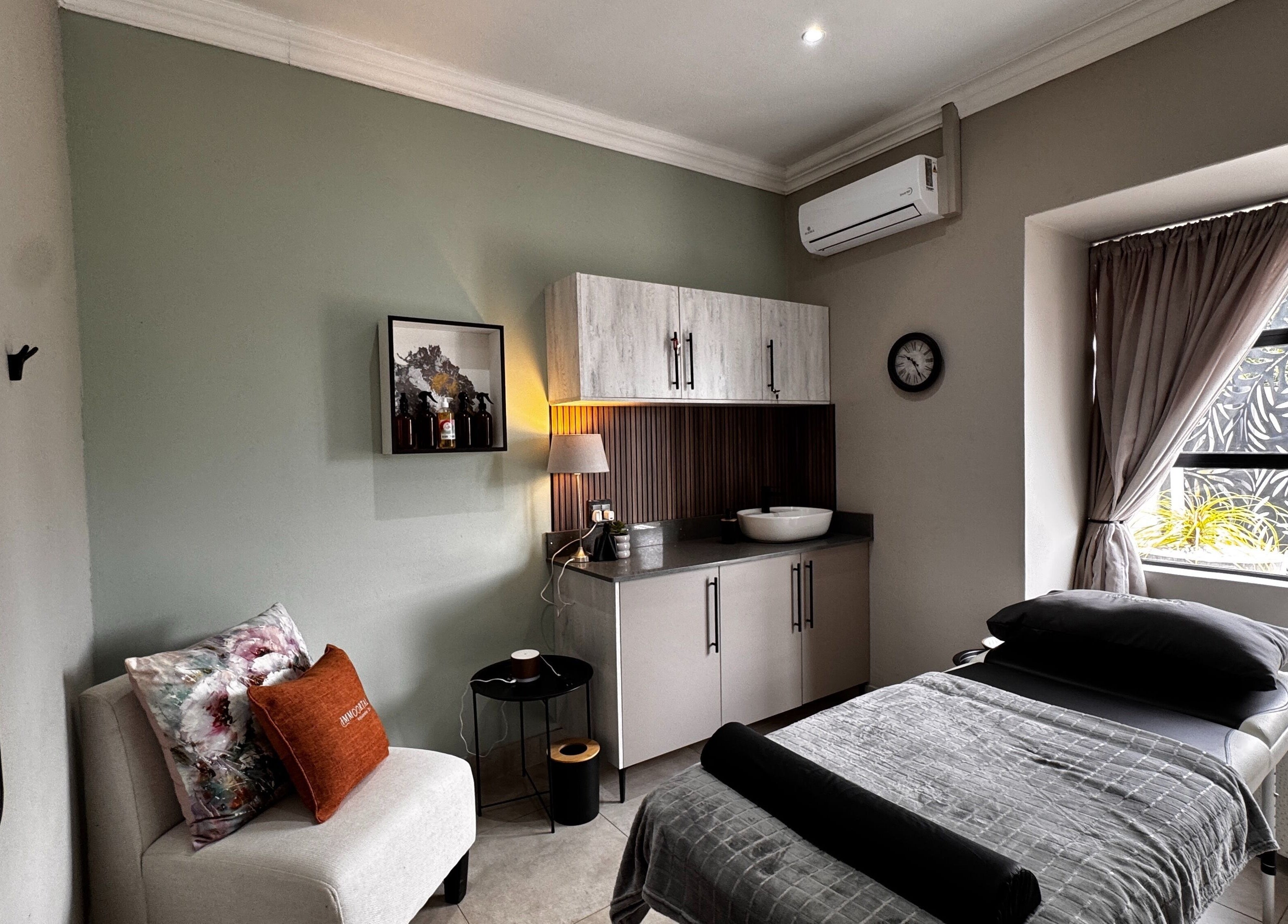 Relaxing treatment room at Immortal Rejuvenation Clinic in Newcastle, Kwazulu-natal, ZA featuring a cozy setup.