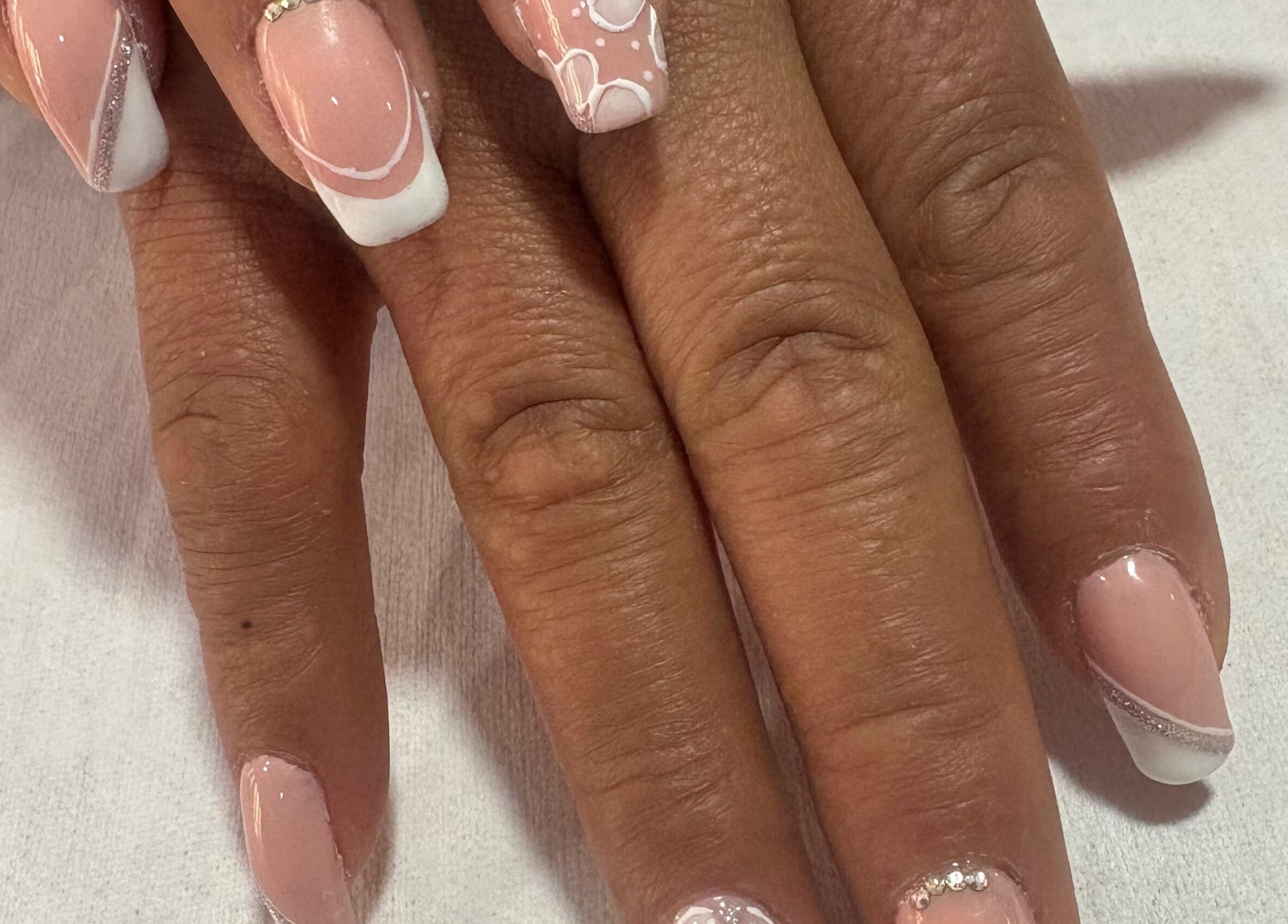 Elegant nail art at Spa Sandra Garcia, Bogotá, D.c., CO enhances nail beauty with creative designs.