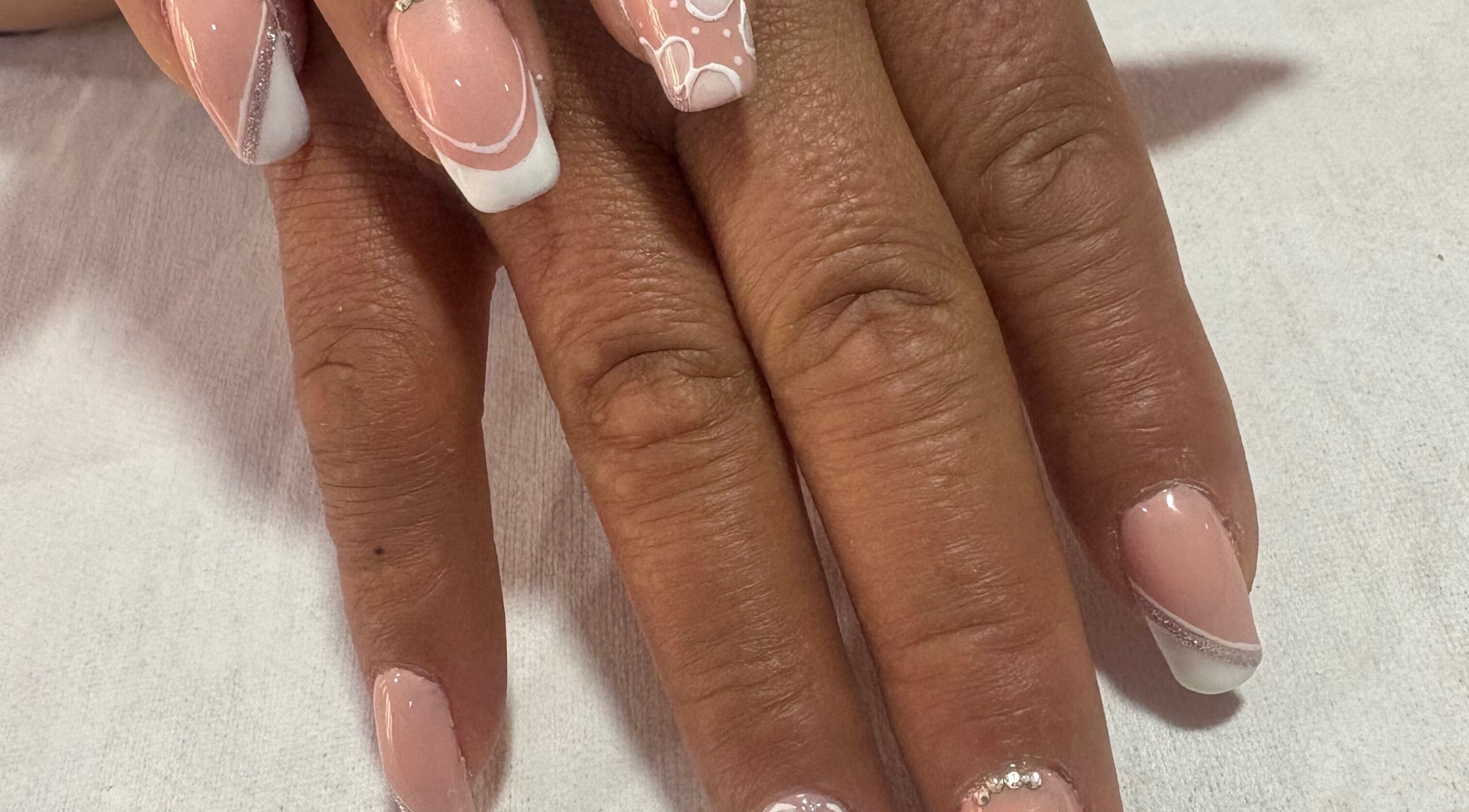 Elegant nail art at Spa Sandra Garcia, Bogotá, D.c., CO enhances nail beauty with creative designs.