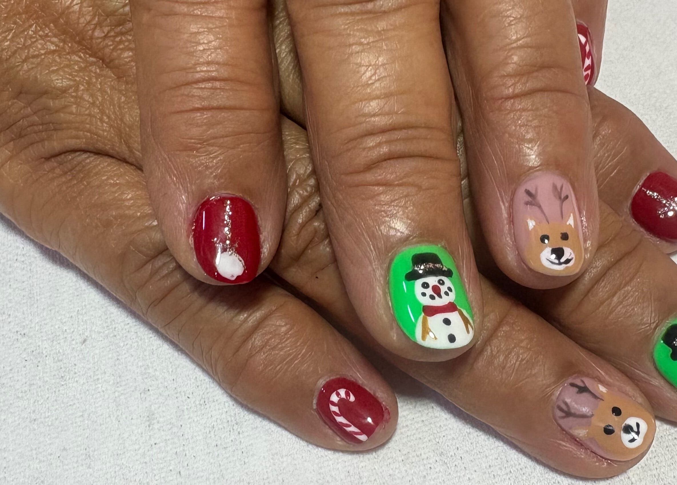Festive nail art with snowmen and reindeer at Spa Sandra Garcia, Bogotá, D.c., Bogotá, D.c., CO.