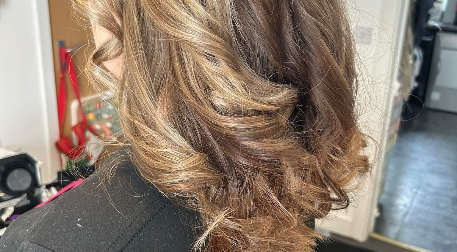 Elegant curled hairstyle at New Image By Kim, Waterlooville, England, GB.