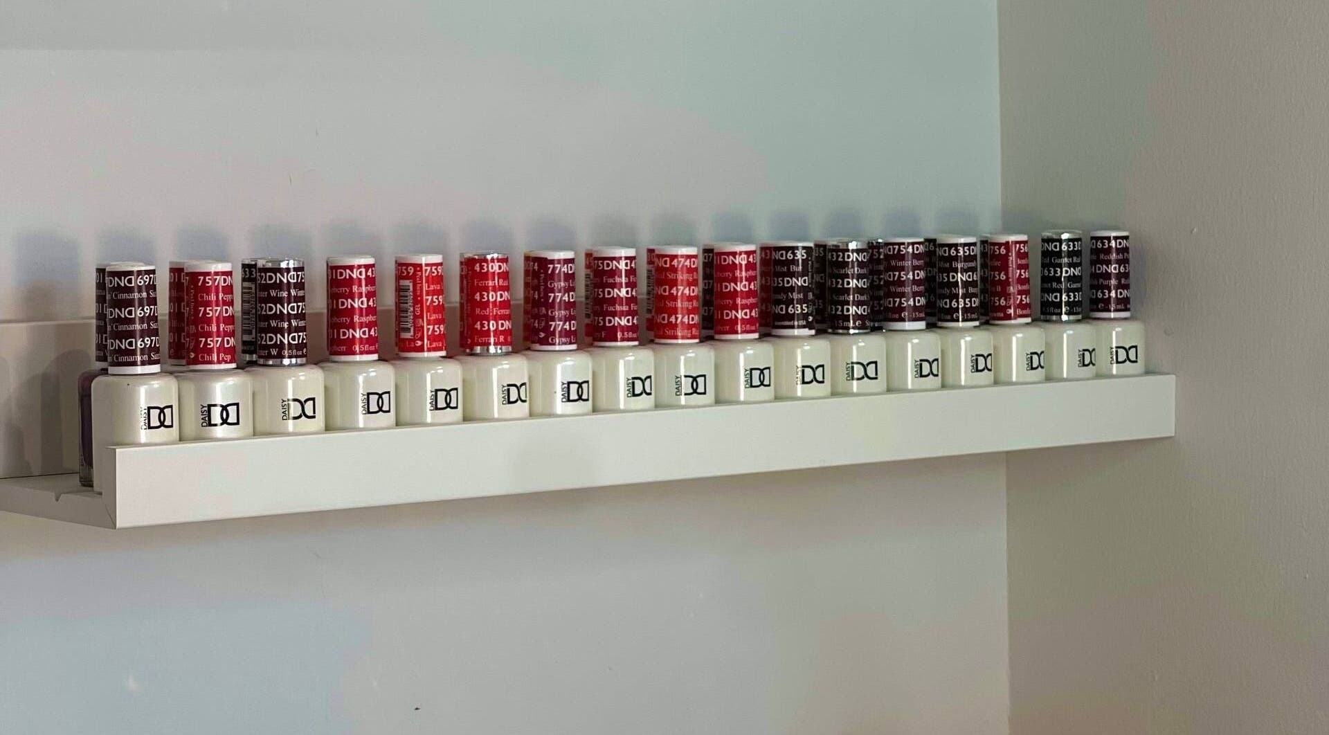 Nail polish bottles at HASO LONDON nail and beauty, London, England, GB, showcasing vibrant colors.