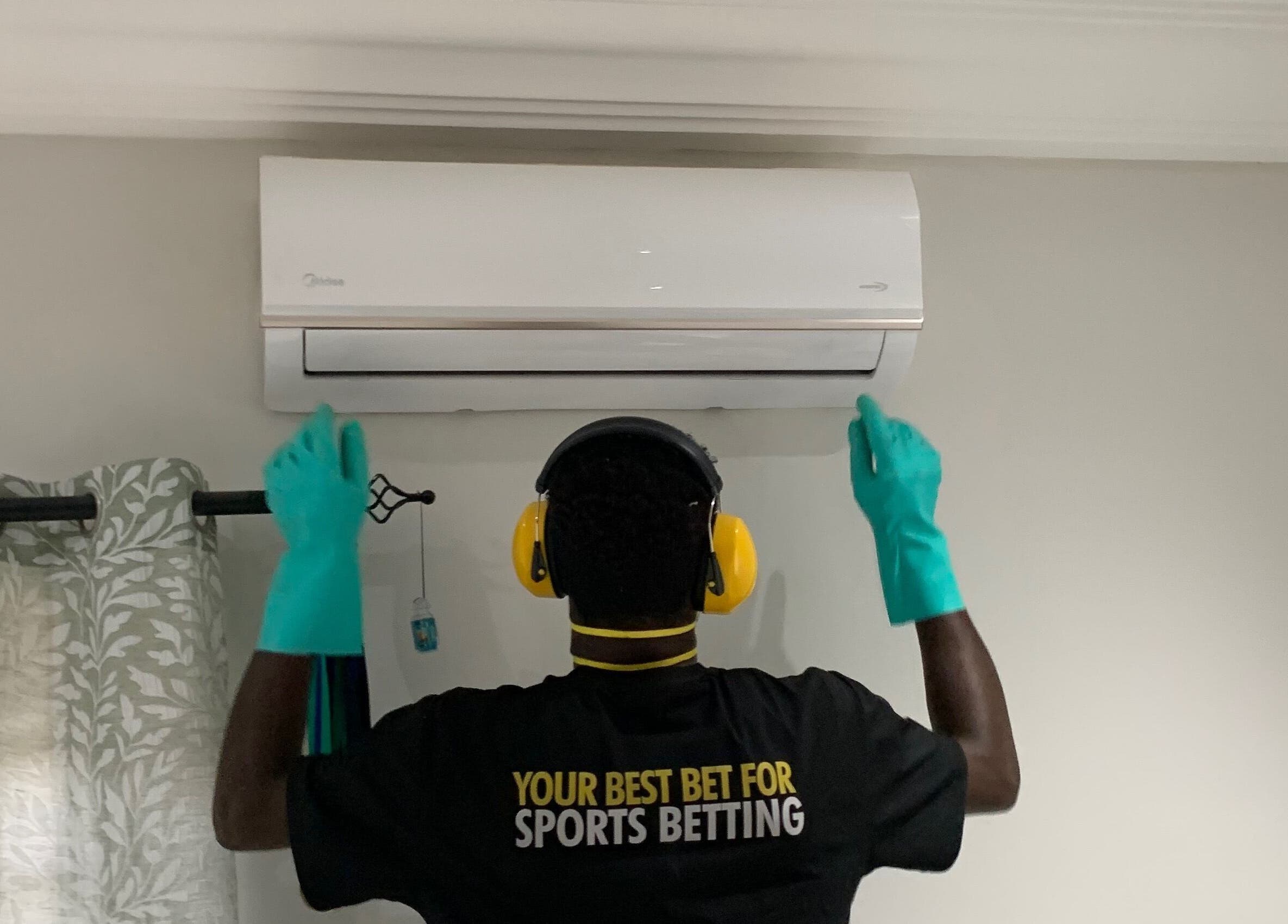 Technician servicing AC unit at Chillboss AC.Services, Adenta Municipality, Greater Accra Region, GH.