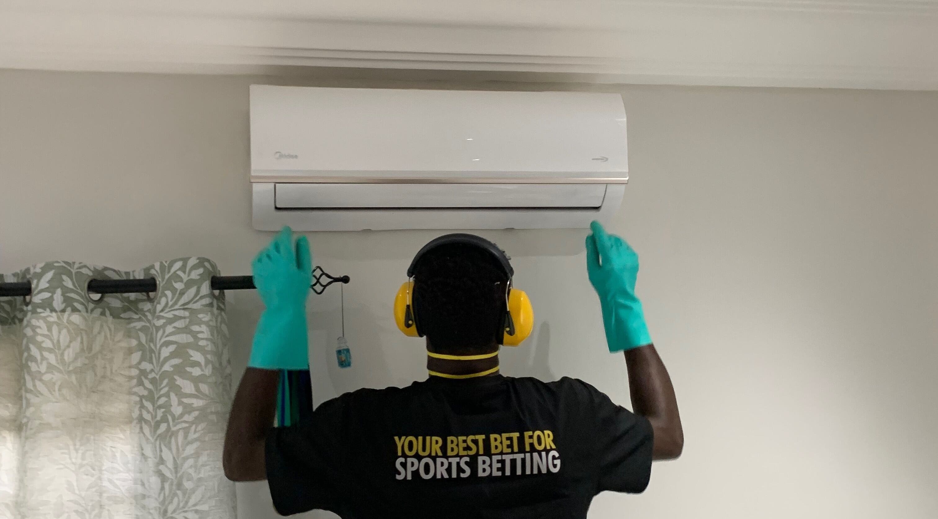 Technician servicing AC unit at Chillboss AC.Services, Adenta Municipality, Greater Accra Region, GH.