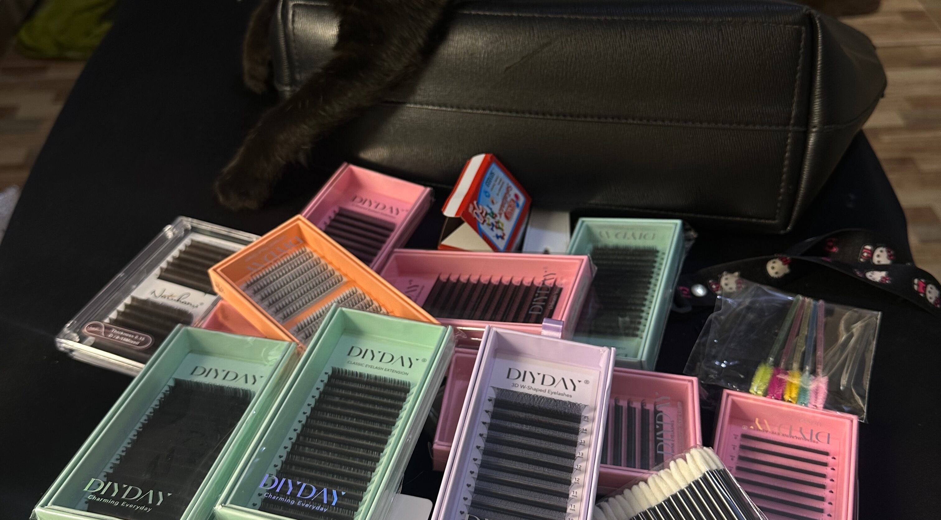 Assorted eyelash extension boxes at Wilashes, Lima, Provincia De Lima, PE, showcasing diverse lash styles.