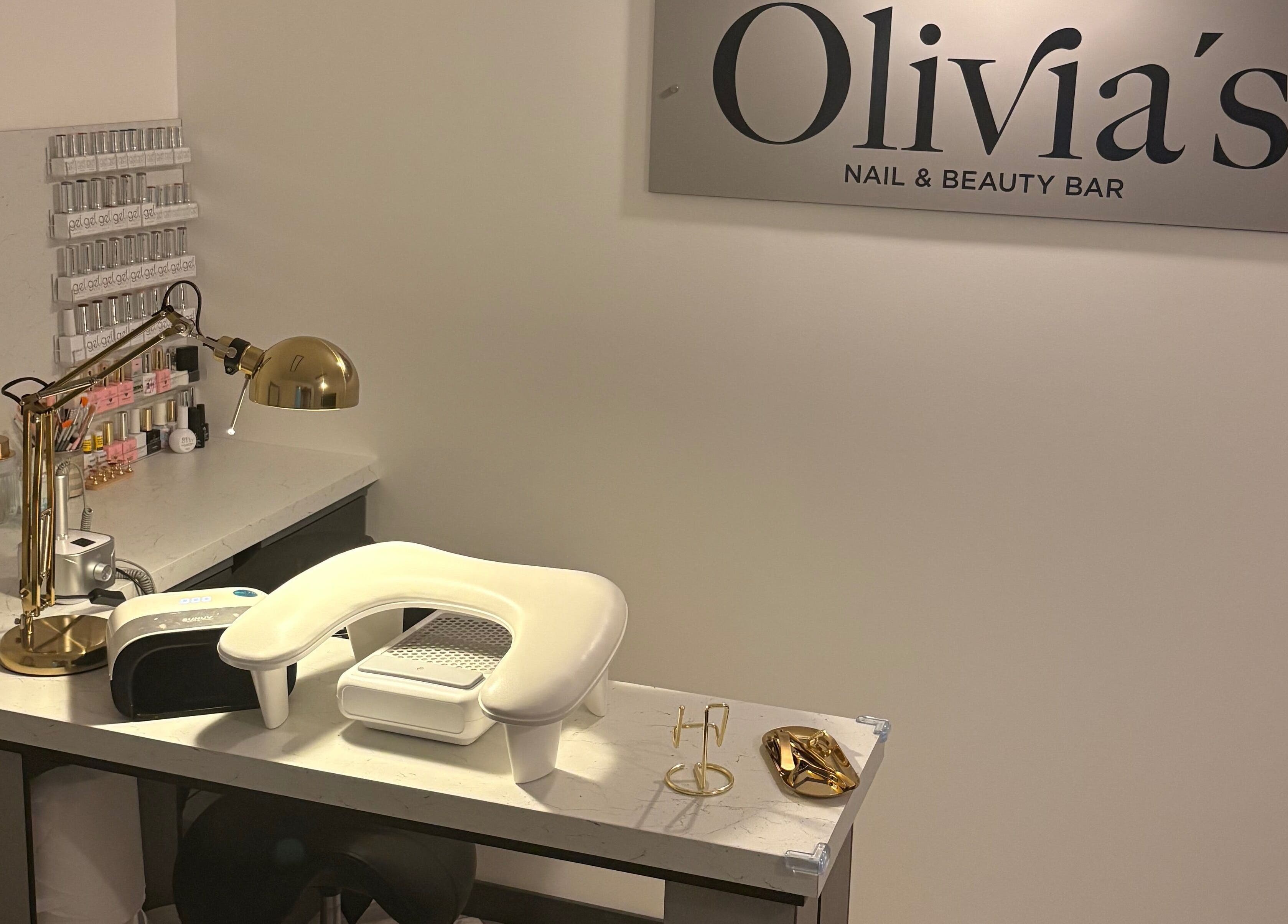 Stylish nail station at Olivia’s Nail and Beauty Bar, Motherwell, Scotland, GB with chic decor and tools.