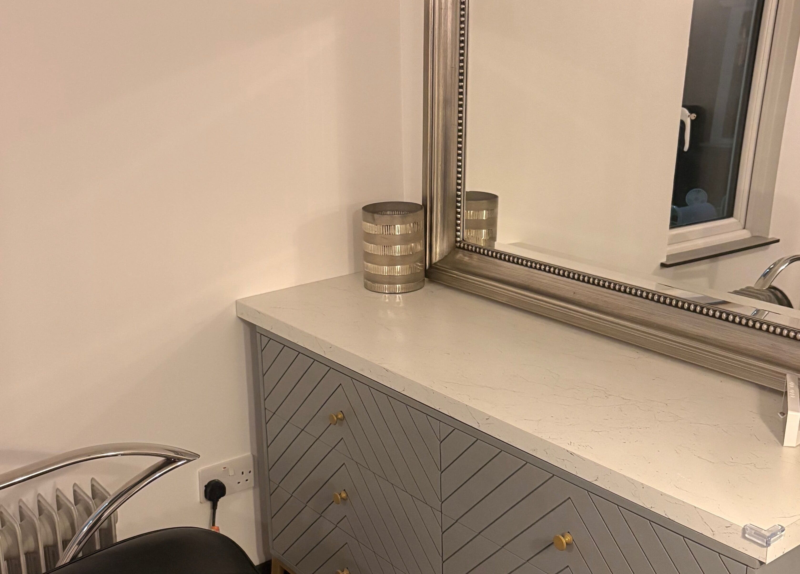 Elegant vanity corner at Olivia’s Nail and Beauty Bar, Motherwell, Scotland, GB featuring sleek mirror and decor.