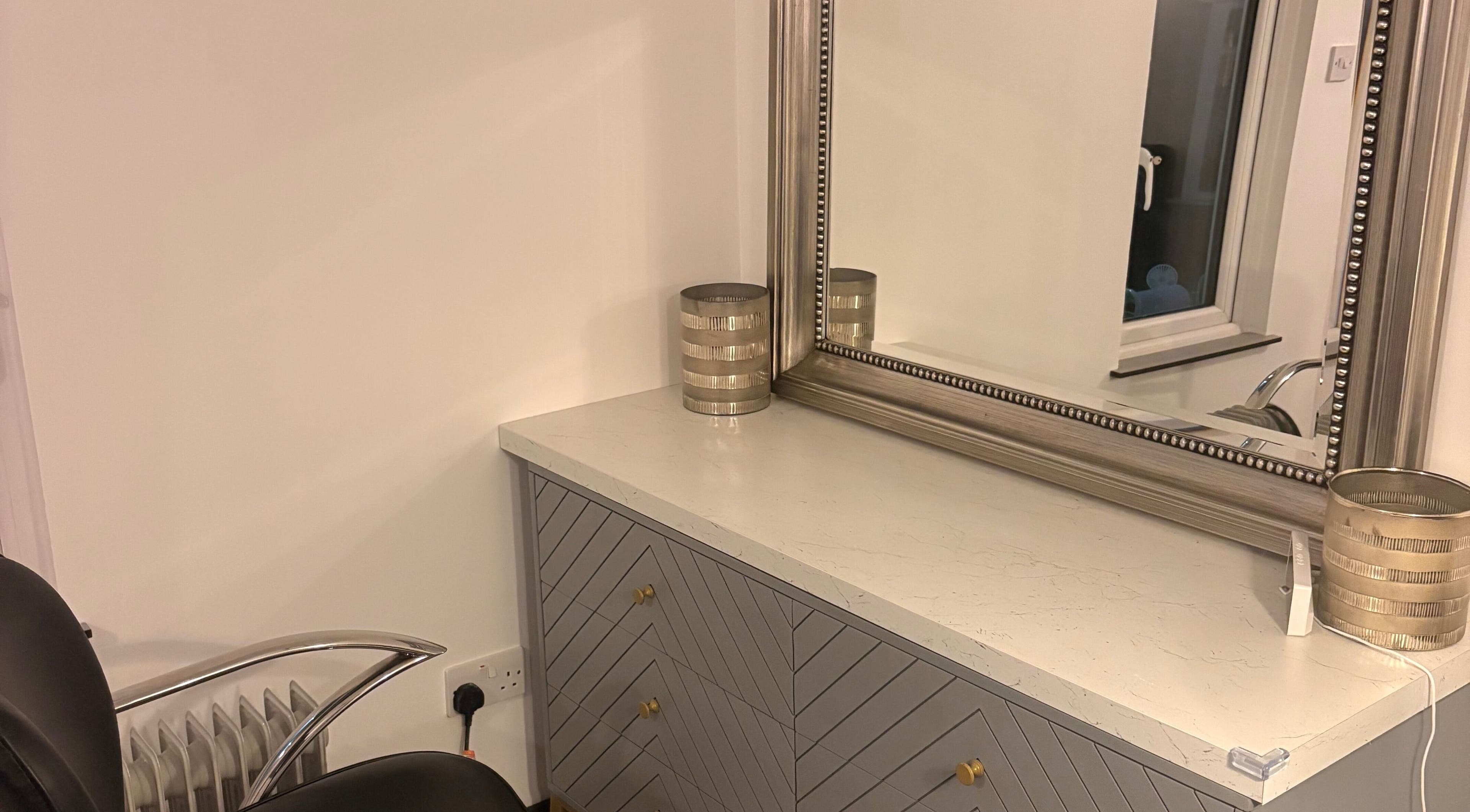 Elegant vanity corner at Olivia’s Nail and Beauty Bar, Motherwell, Scotland, GB featuring sleek mirror and decor.