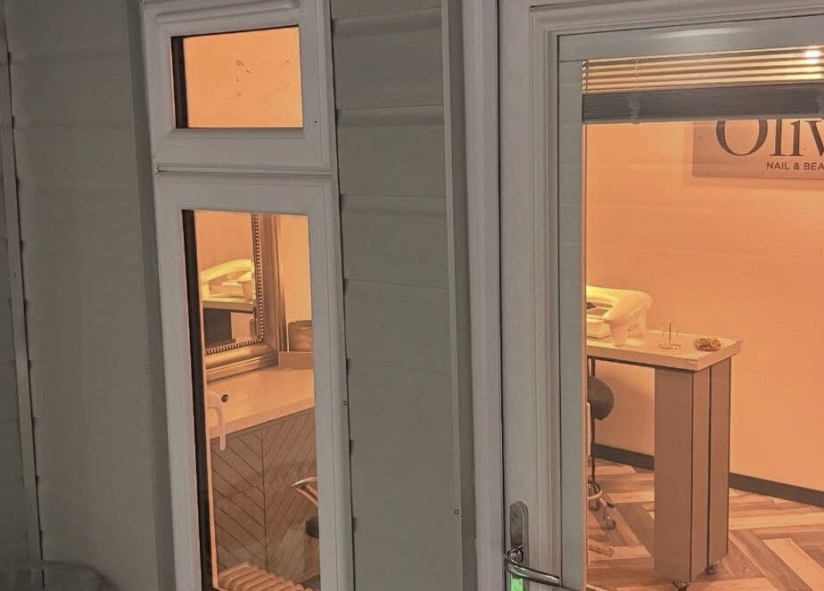 Exterior view into Olivia’s Nail and Beauty Bar in Motherwell, Scotland, showing a cozy and inviting salon setup.