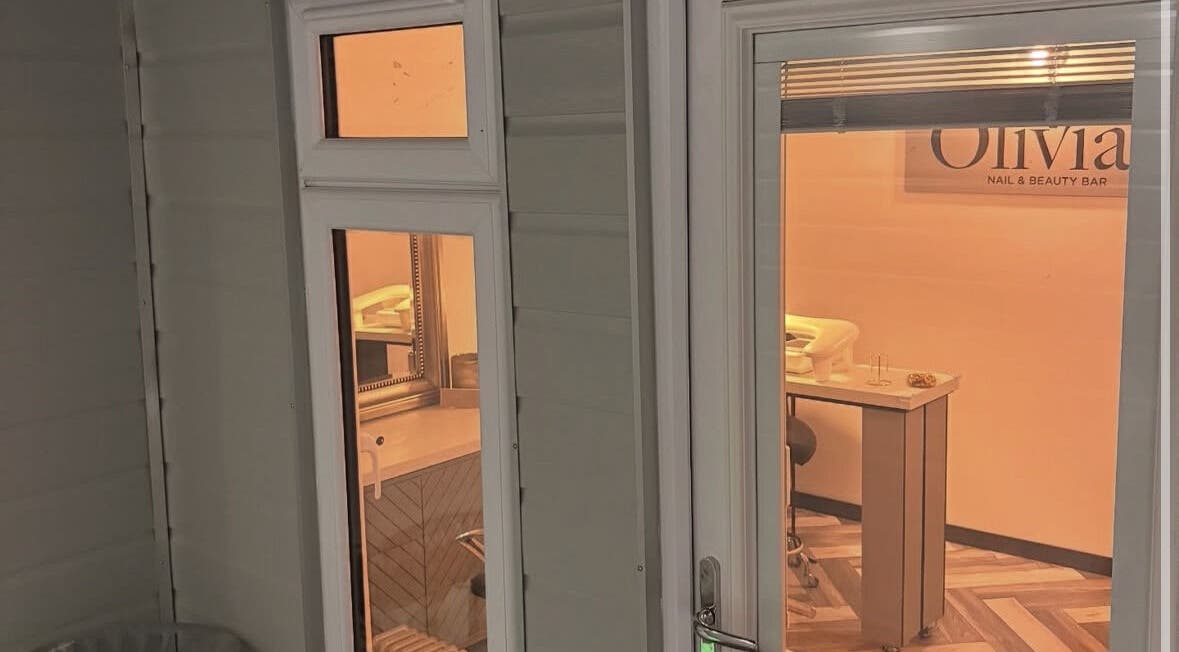 Exterior view into Olivia’s Nail and Beauty Bar in Motherwell, Scotland, showing a cozy and inviting salon setup.