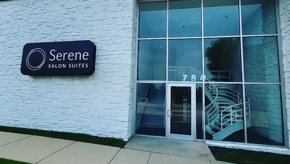 Entrance of Touchpoint Therapy in Highland Park, Illinois, US featuring glass doors and spiral staircase.