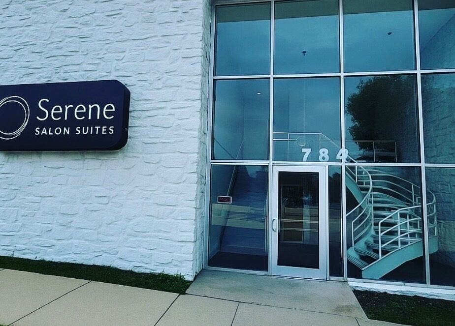 Entrance of Touchpoint Therapy in Highland Park, Illinois, US featuring glass doors and spiral staircase.