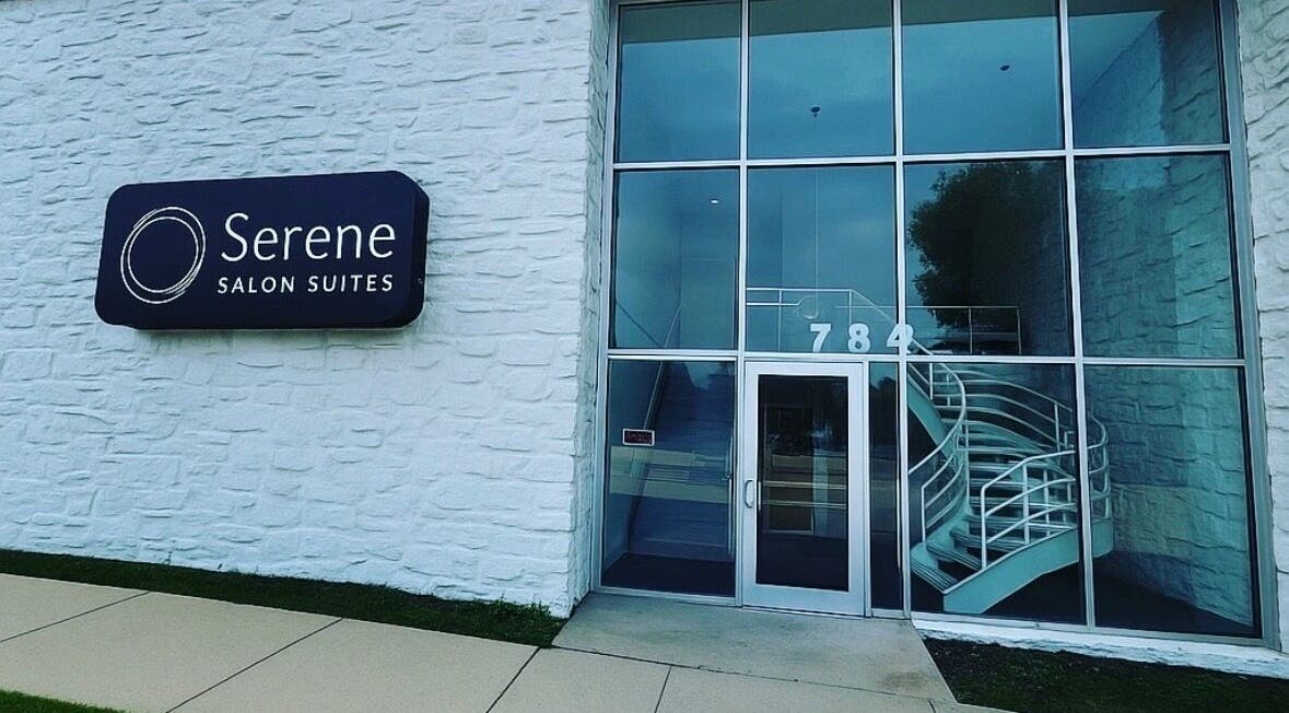 Entrance of Touchpoint Therapy in Highland Park, Illinois, US featuring glass doors and spiral staircase.