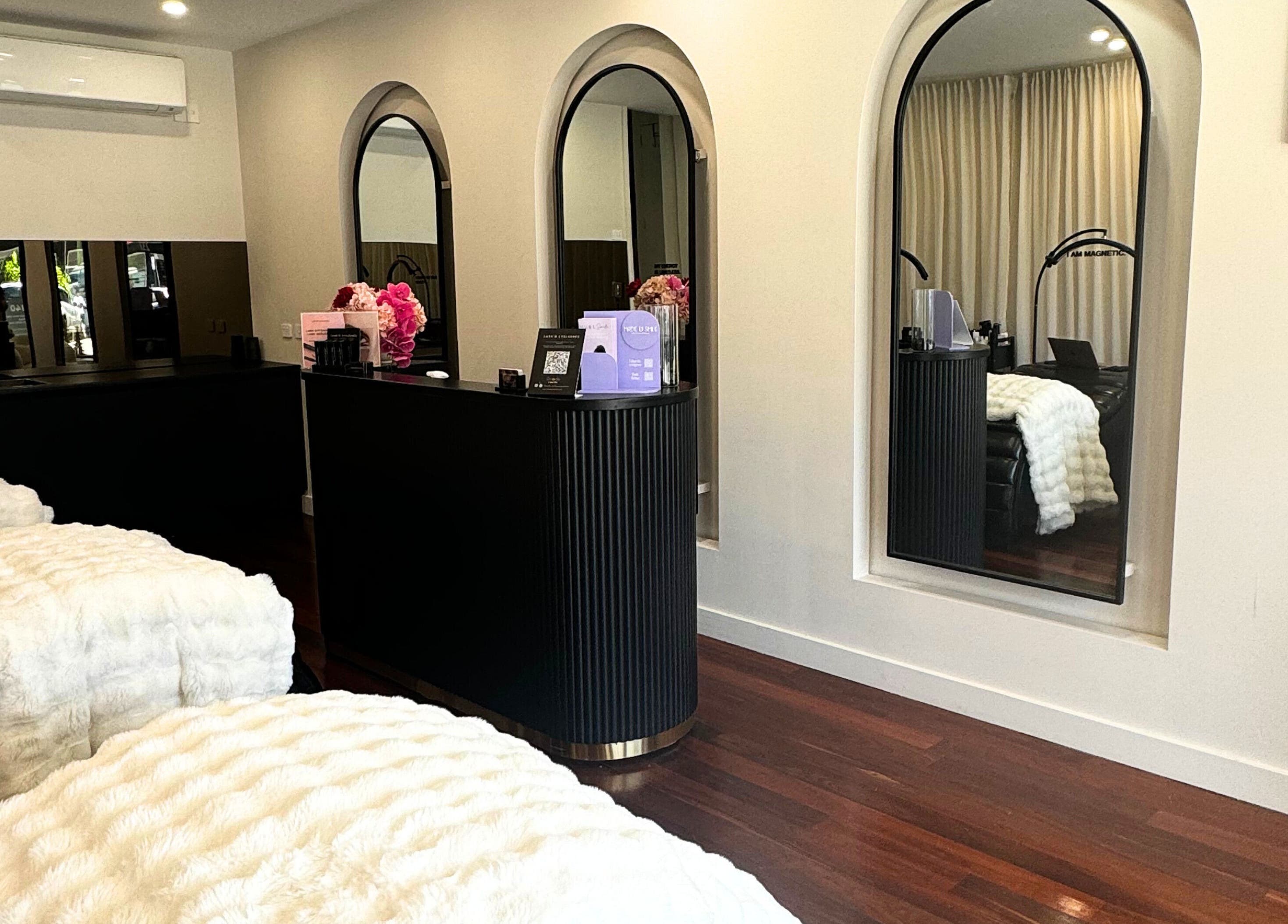 Elegant Lash'd Eyelash Extensions studio in IVANHOE, Victoria featuring plush decor and modern mirrors.