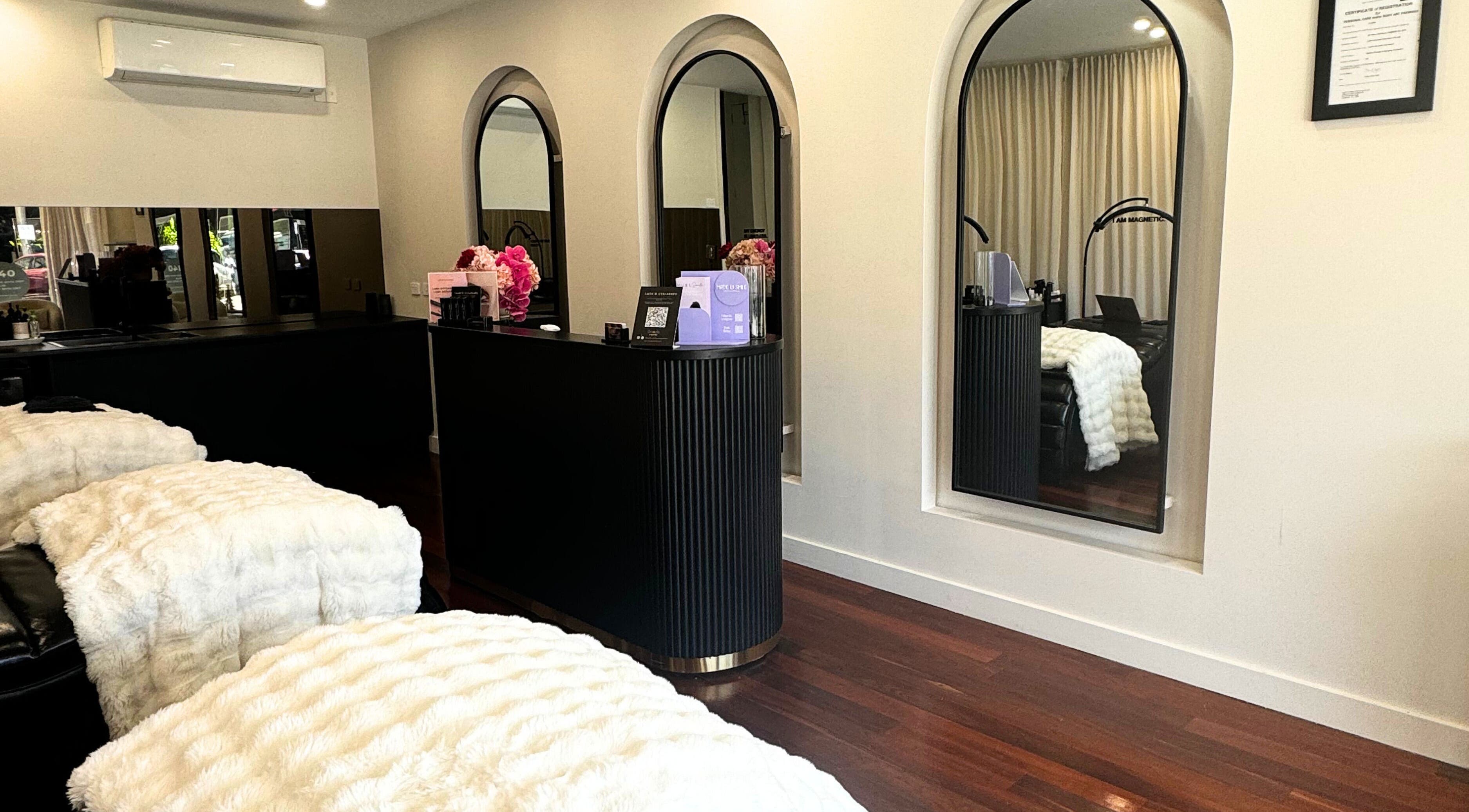 Elegant Lash'd Eyelash Extensions studio in IVANHOE, Victoria featuring plush decor and modern mirrors.