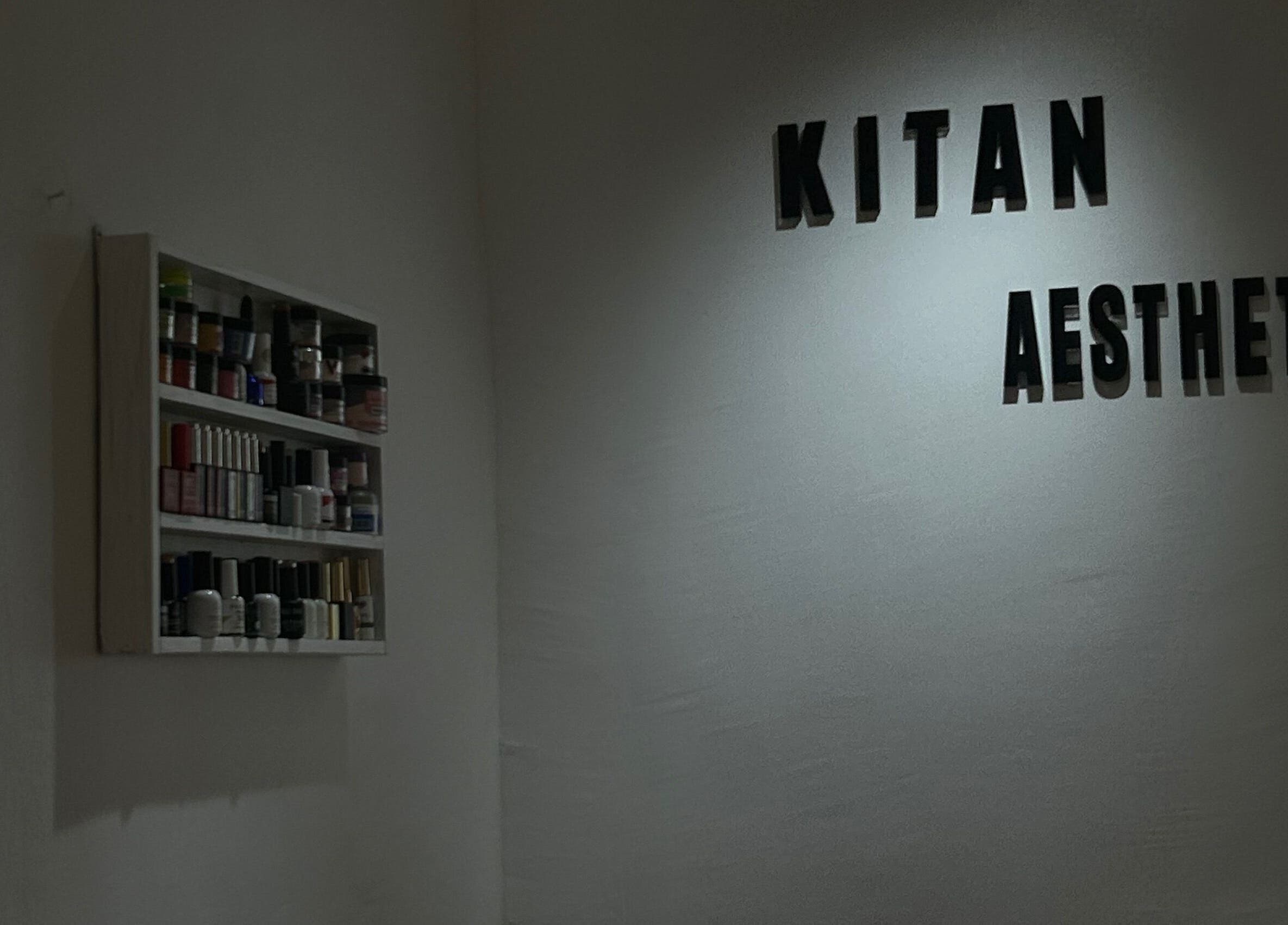Minimalist shelving and 'Kitanaesthetics' wall decor in Lagos, Lagos, NG beauty and wellness venue.