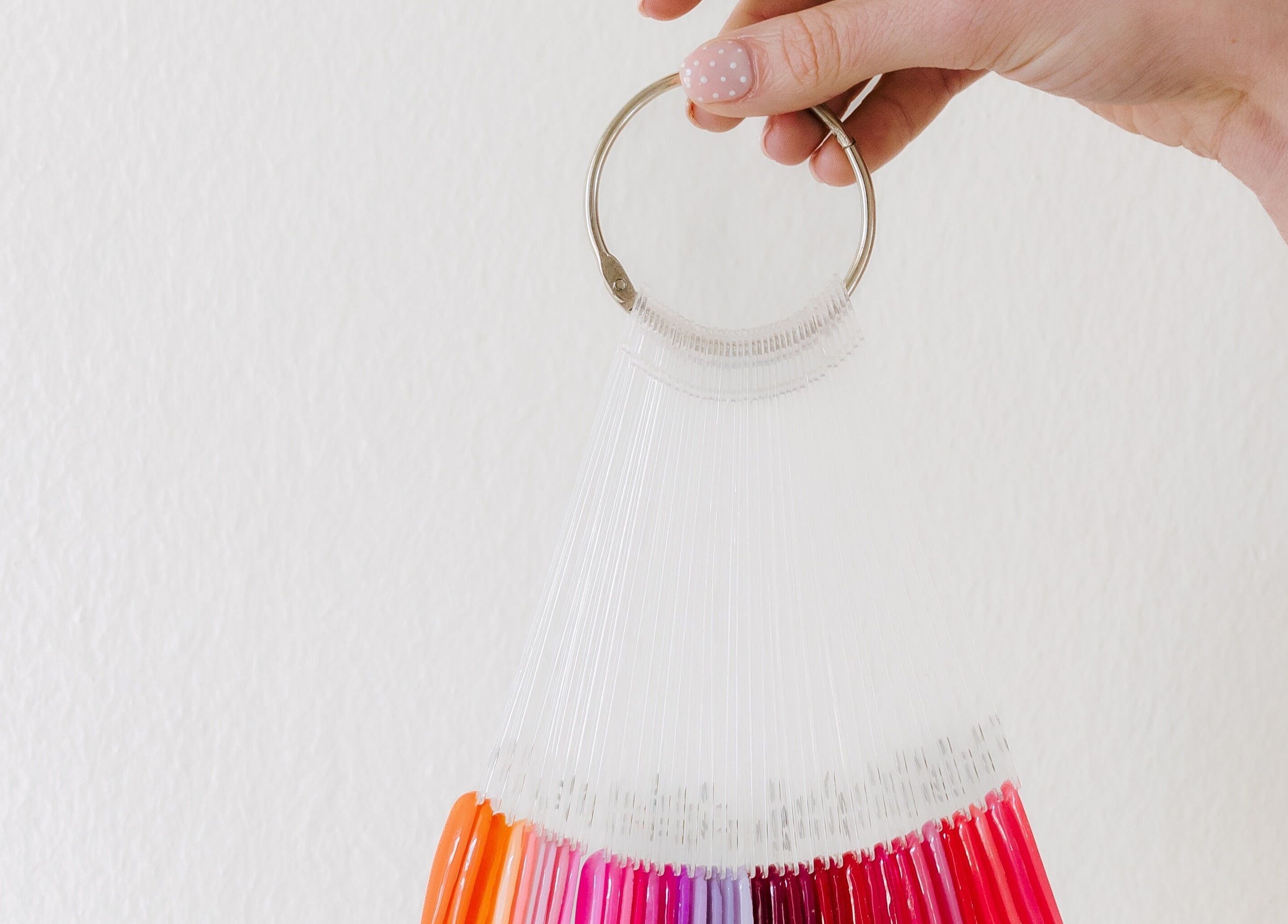 Colorful nail polish swatch ring at Heath Chromatic, Pretoria, Gauteng, ZA. Explore vibrant shades and designs.