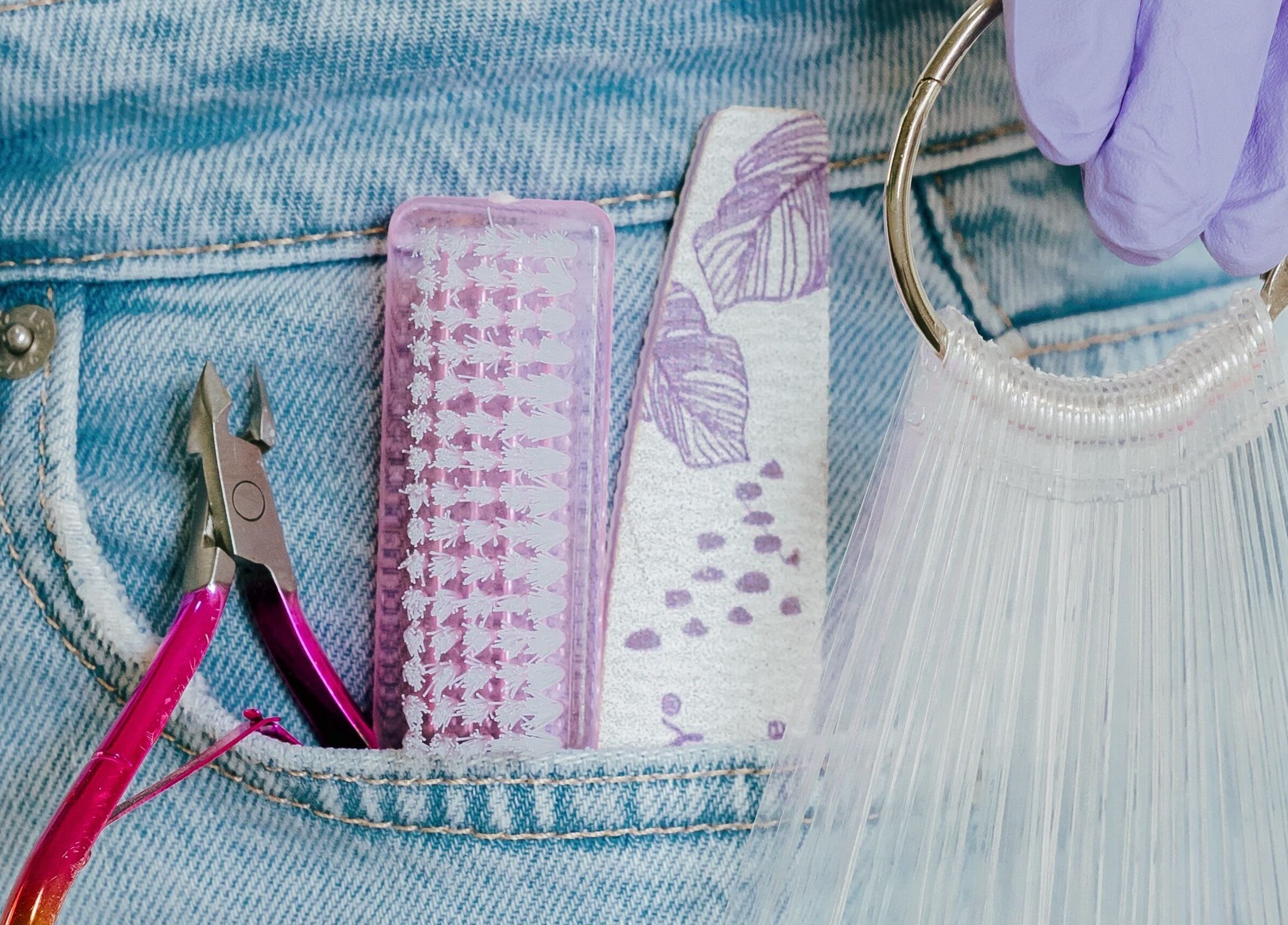 Beauty tools in denim pocket at Heath Chromatic, Pretoria, Gauteng, ZA. Nail care essentials on display.