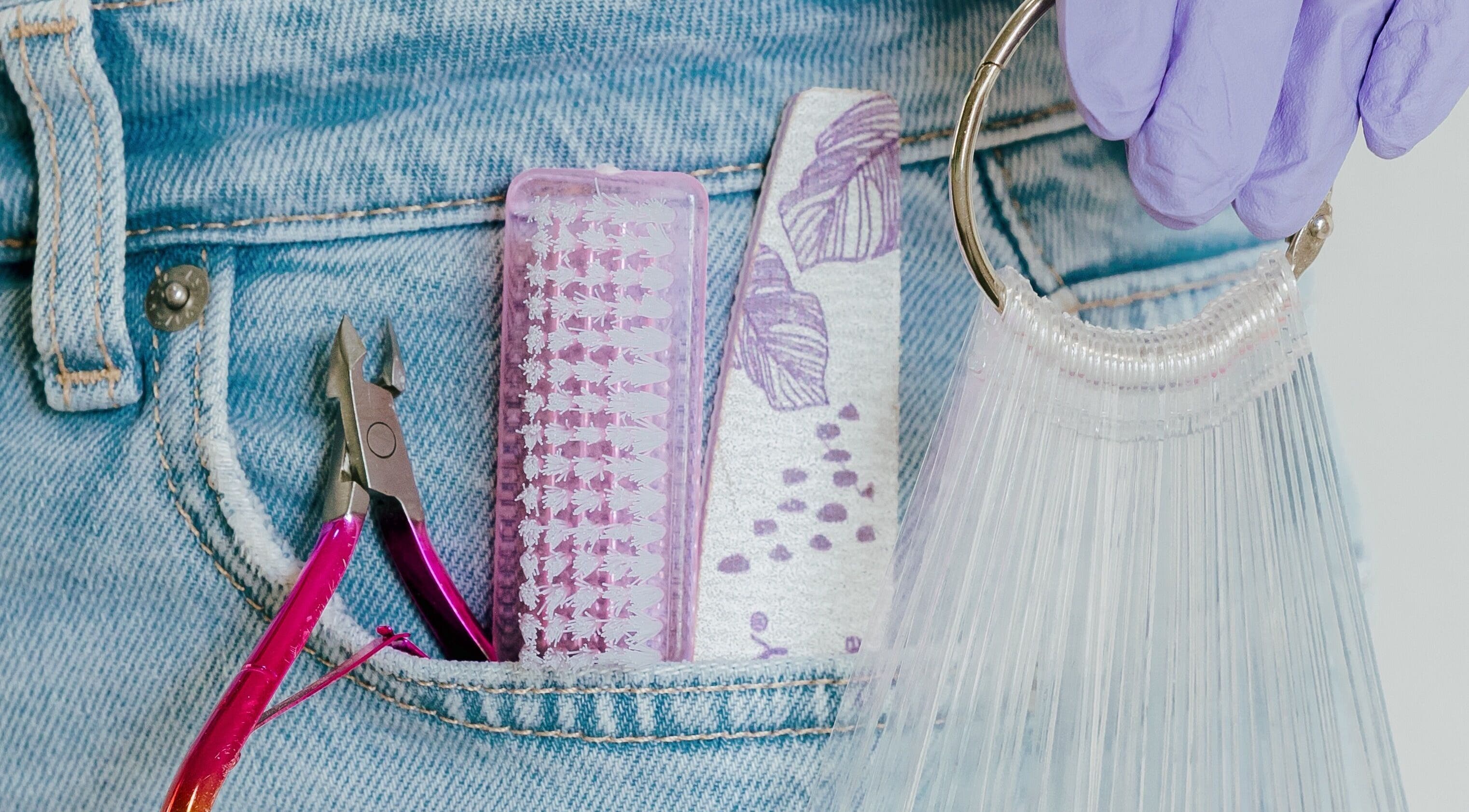 Beauty tools in denim pocket at Heath Chromatic, Pretoria, Gauteng, ZA. Nail care essentials on display.
