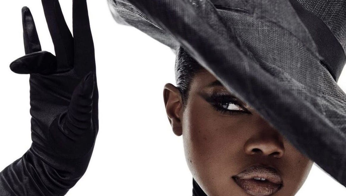 Elegant woman in black hat and gloves at B’yadecha, Québec, Québec, CA.