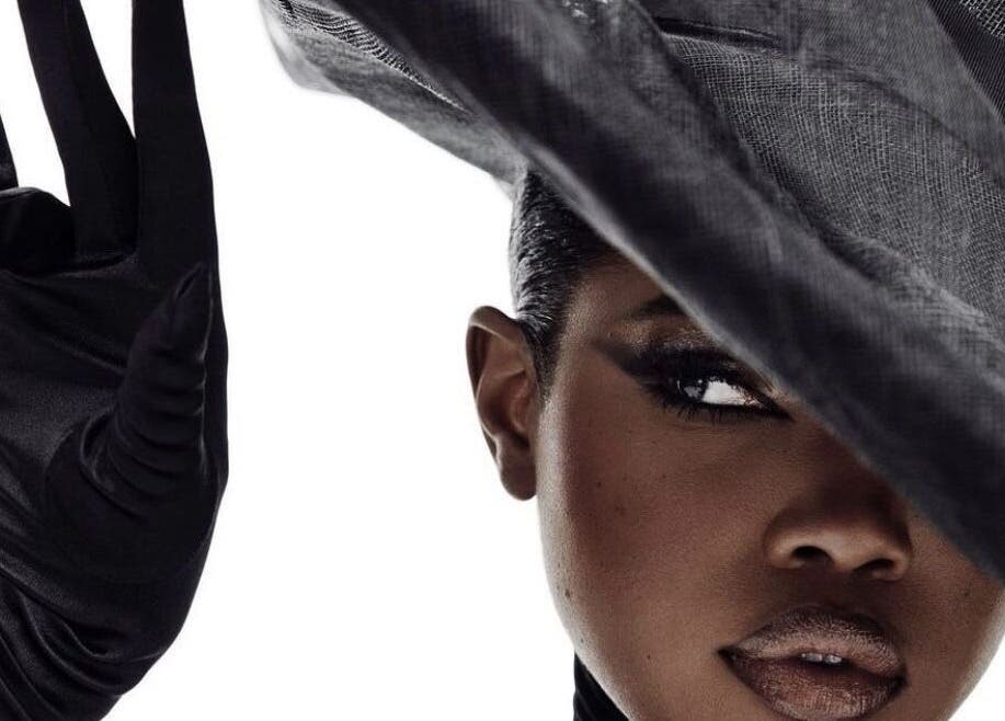 Elegant woman in black hat and gloves at B’yadecha, Québec, Québec, CA.