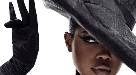 Glamorous figure with a stylish hat at B’yadecha, Québec, Québec, CA, showcasing elegance and sophistication.